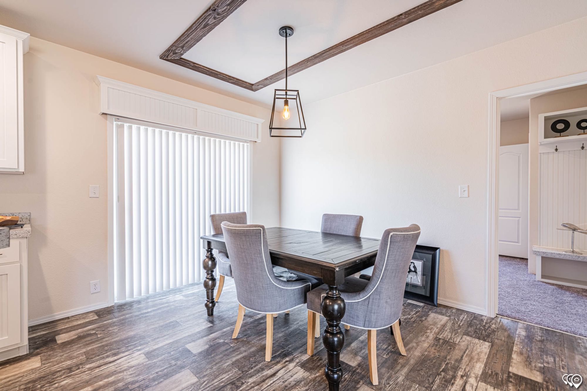 Dining area with a table that seats 4.