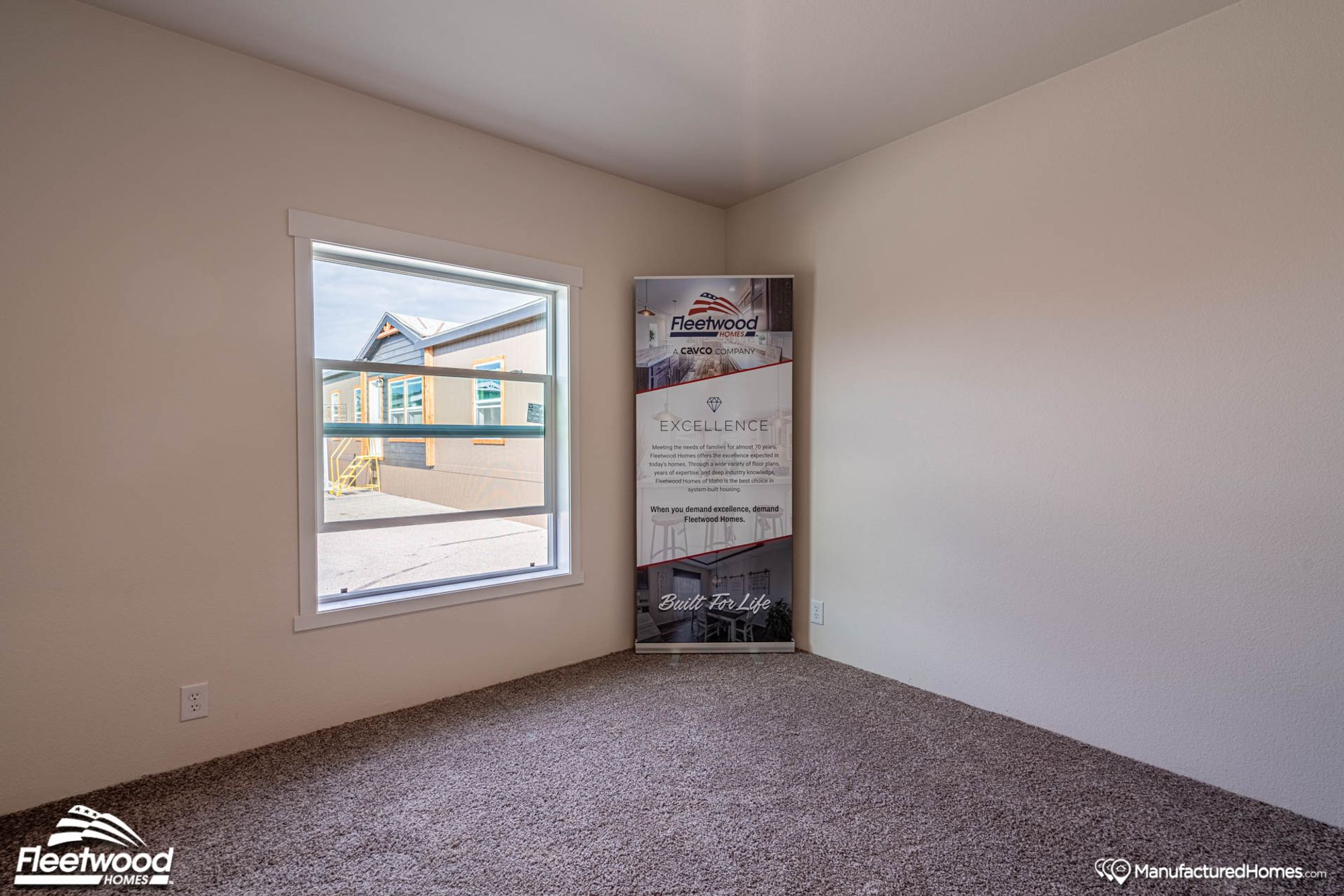 Empty small room with a poster board.