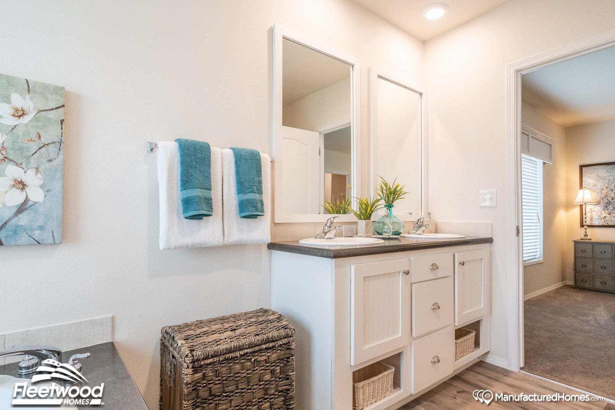 Partial view of a bathroom and a glimpse of a bedroom.