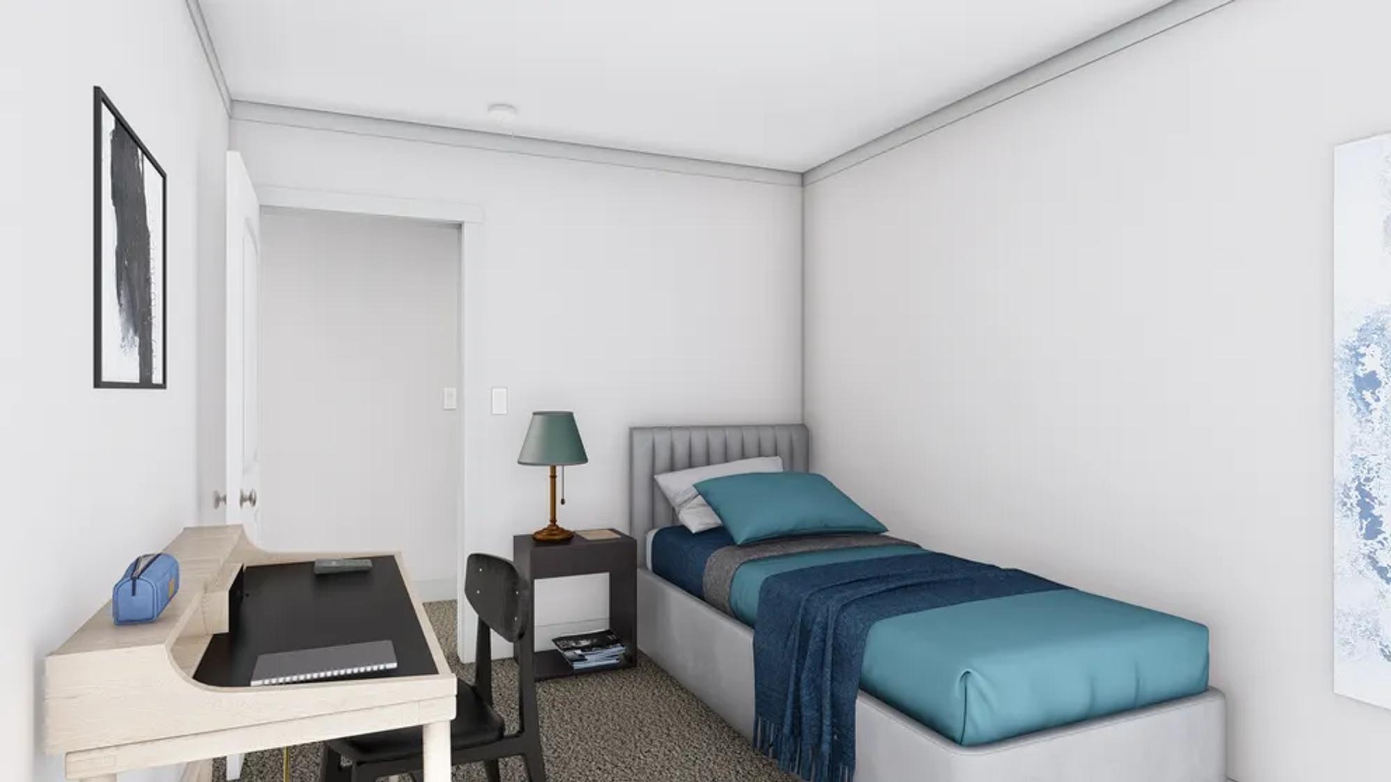 Mid-sized bedroom with a twin bed , a desk, and a side table.