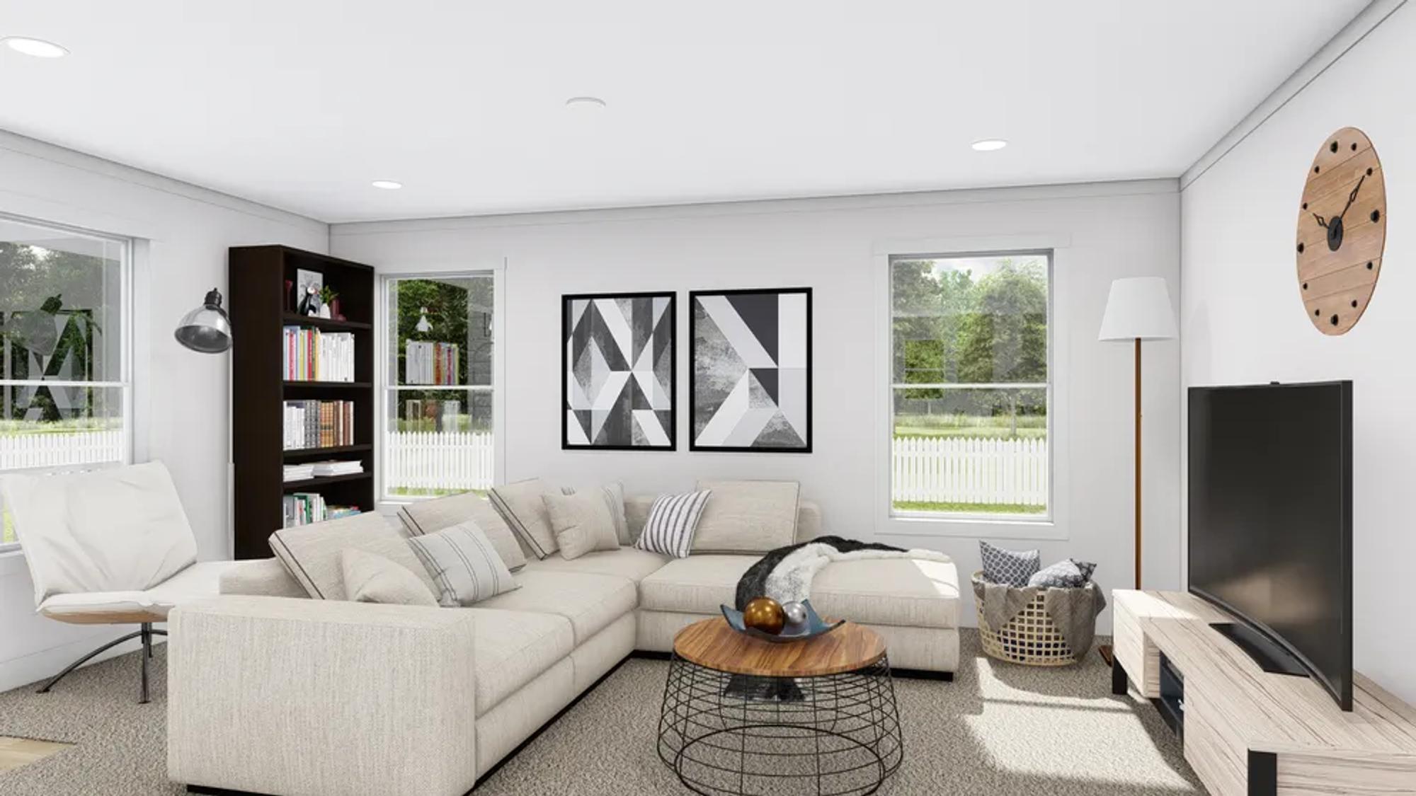 Midsized living room with an L-shaped couch, soft neutral tones, and natural light from large front windows.