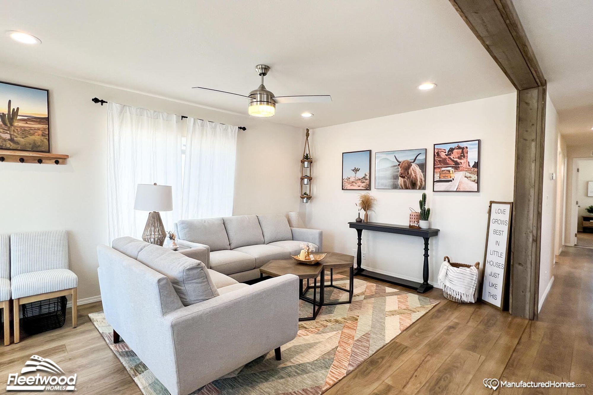 Mid-sized living room with two couches, a coffee table, a side table, and two chairs in the background.