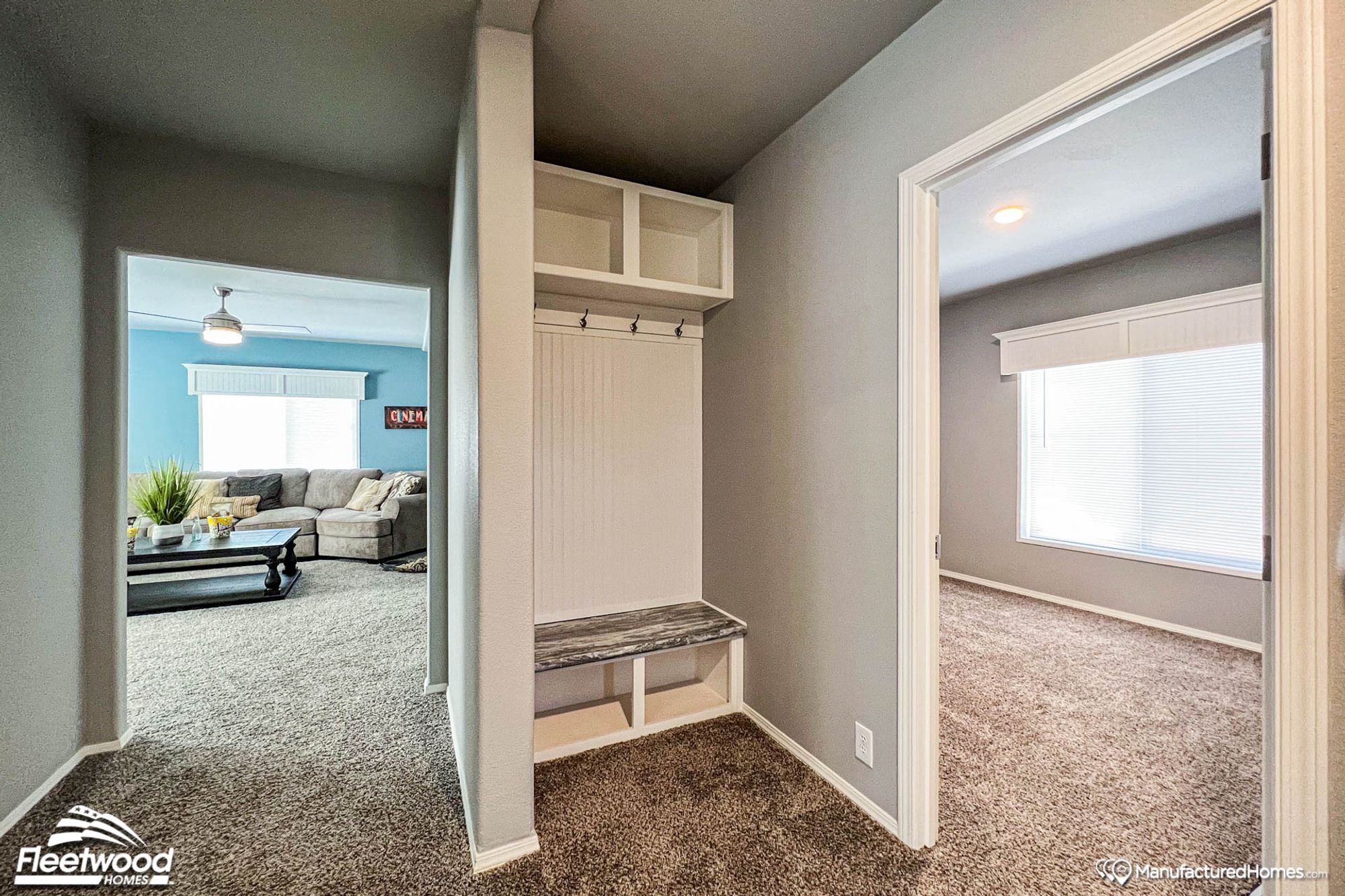 Entryway with a small alcove featuring hooks, a small bench, and two cubbies.