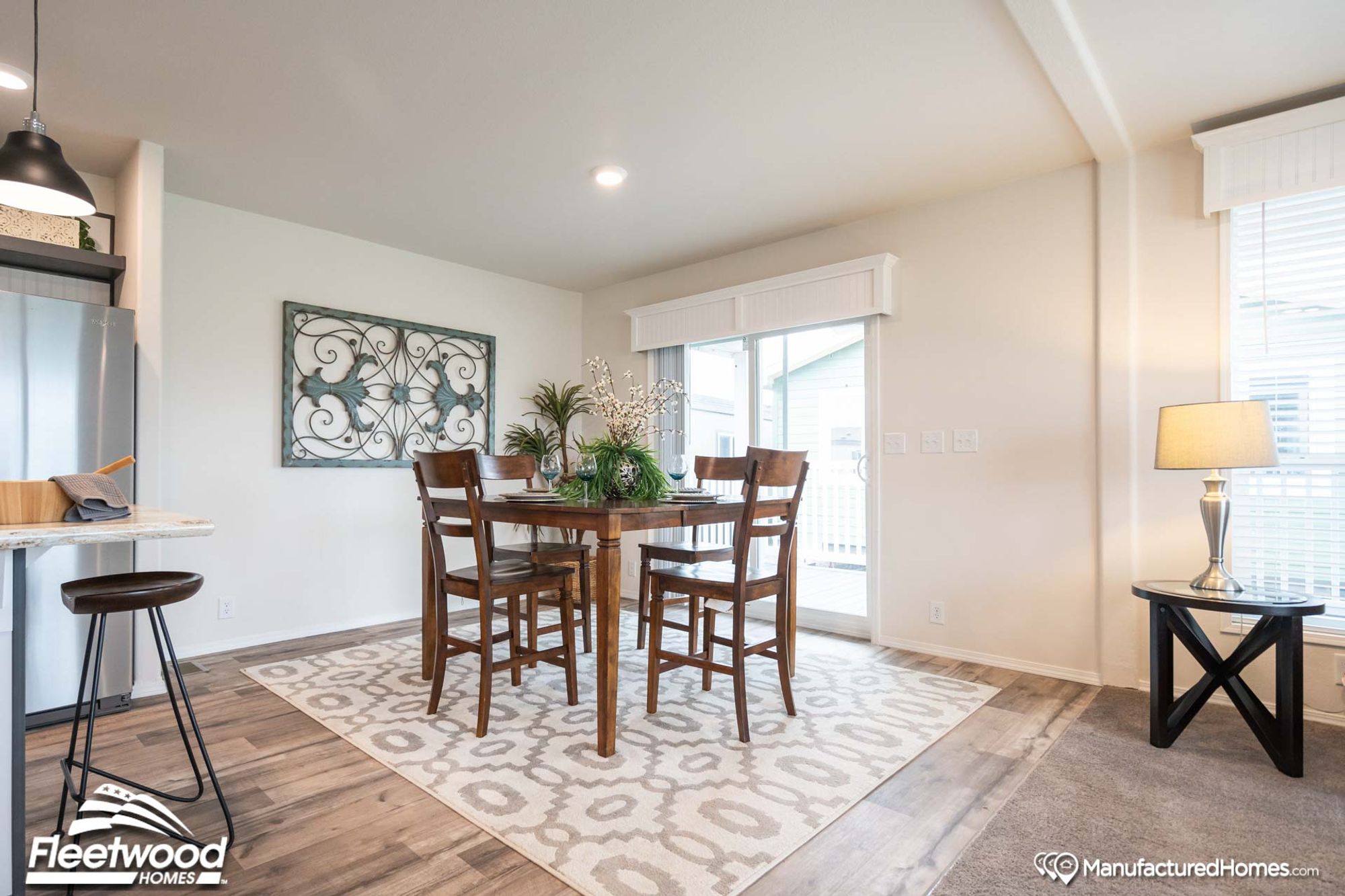 Large dining room with a table that seats 4.