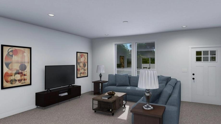 Large front room with a sectional couch, an entertainment center, and a coffee table.