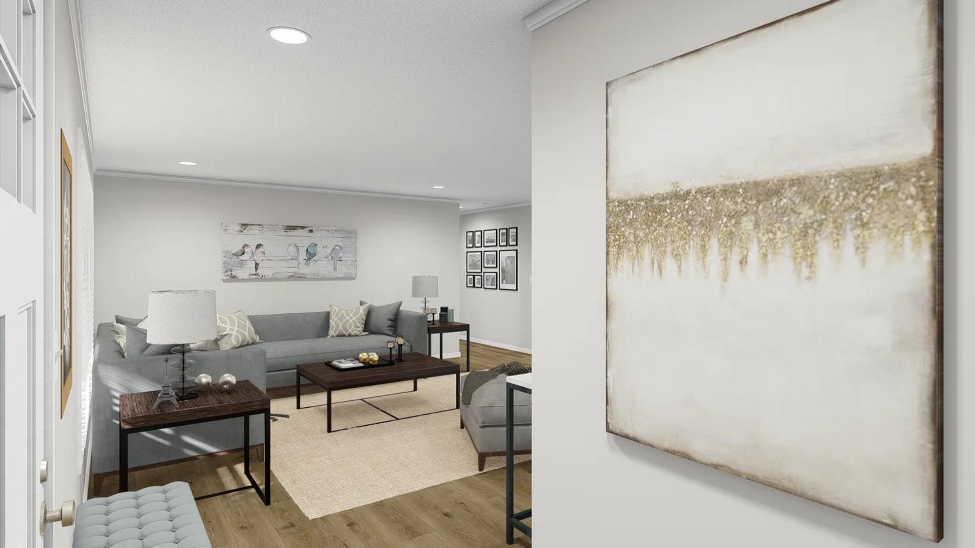 Partial view of a living room with grey couches.