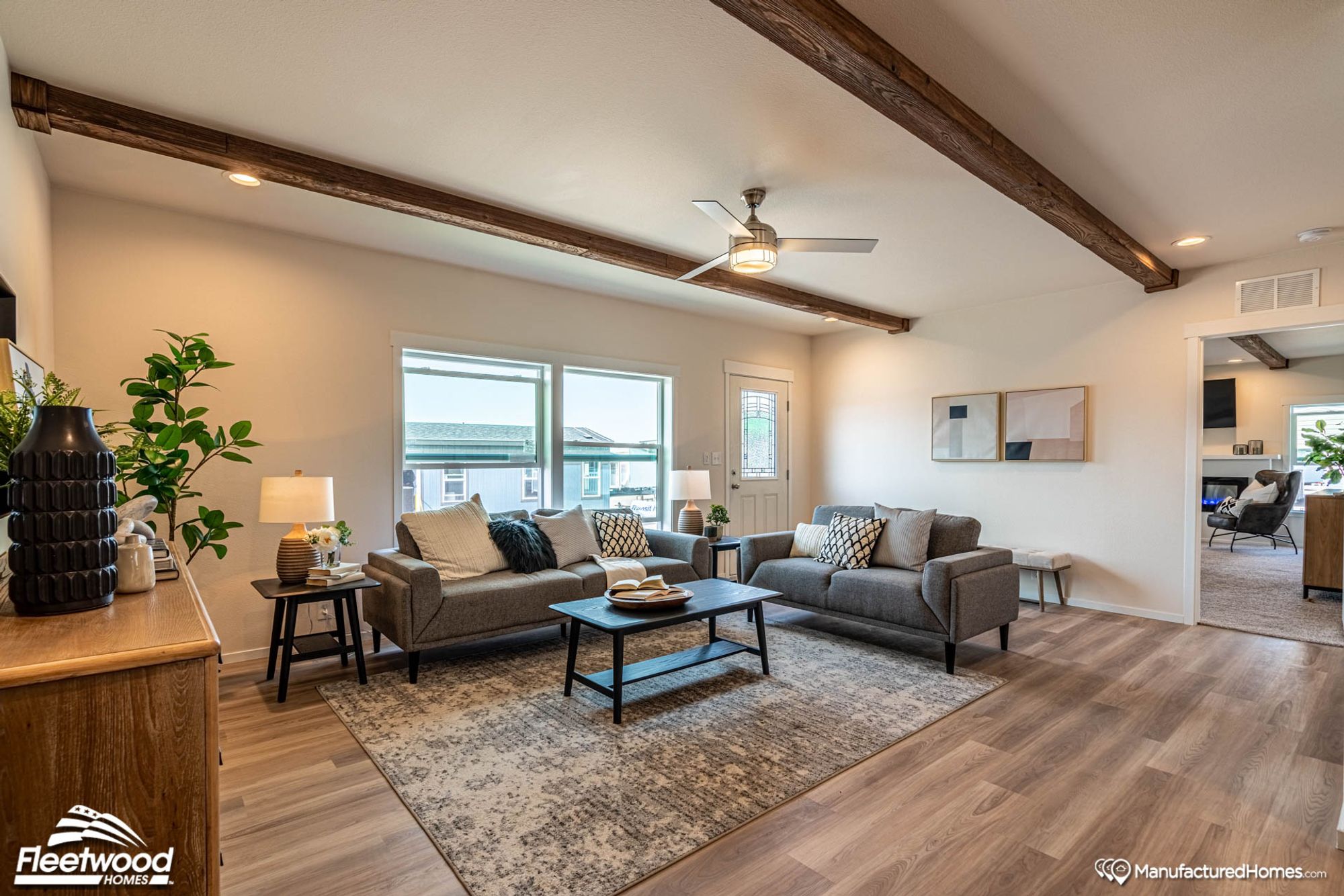 Large living room with two couches and a coffee table.