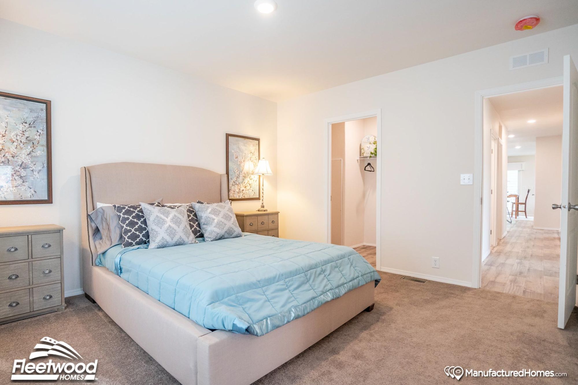 Medium-sized room with a full-sized bed and two bed-side tables.