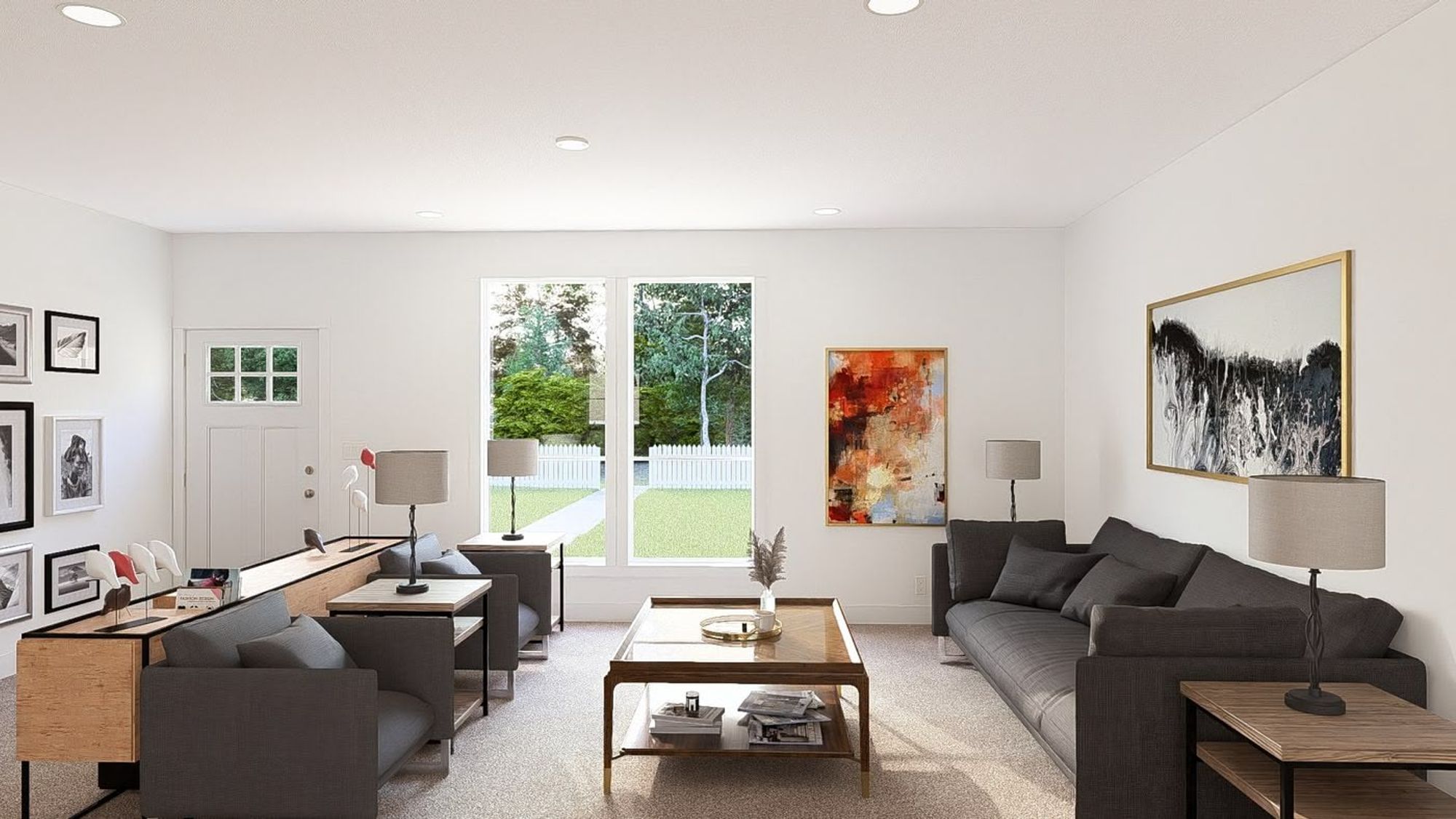 A spacious front room with a couch facing two other chairs, a coffee table, an entryway in the back, and large front windows.