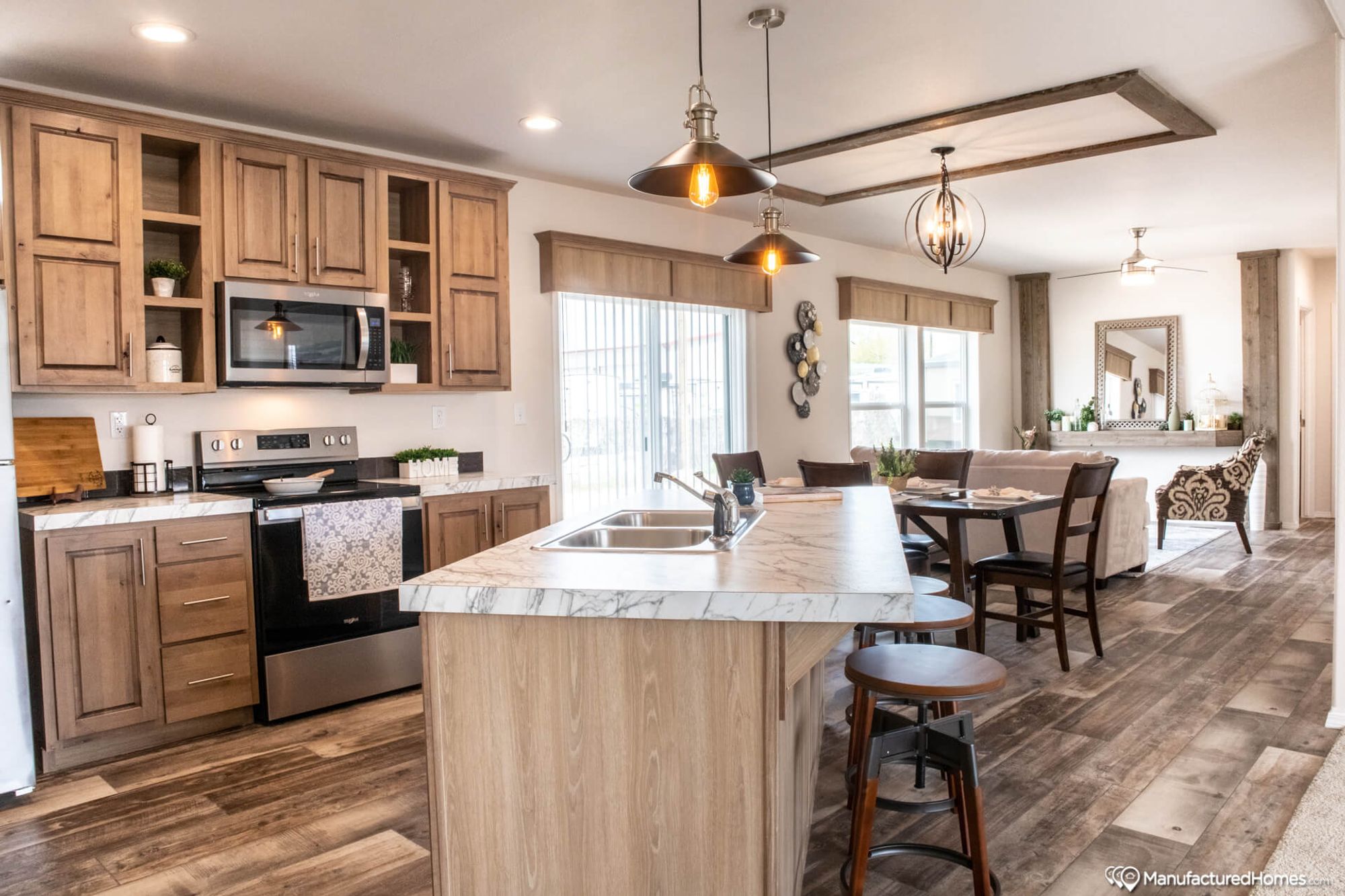 Open-concept kitchen with an island and a dining room.