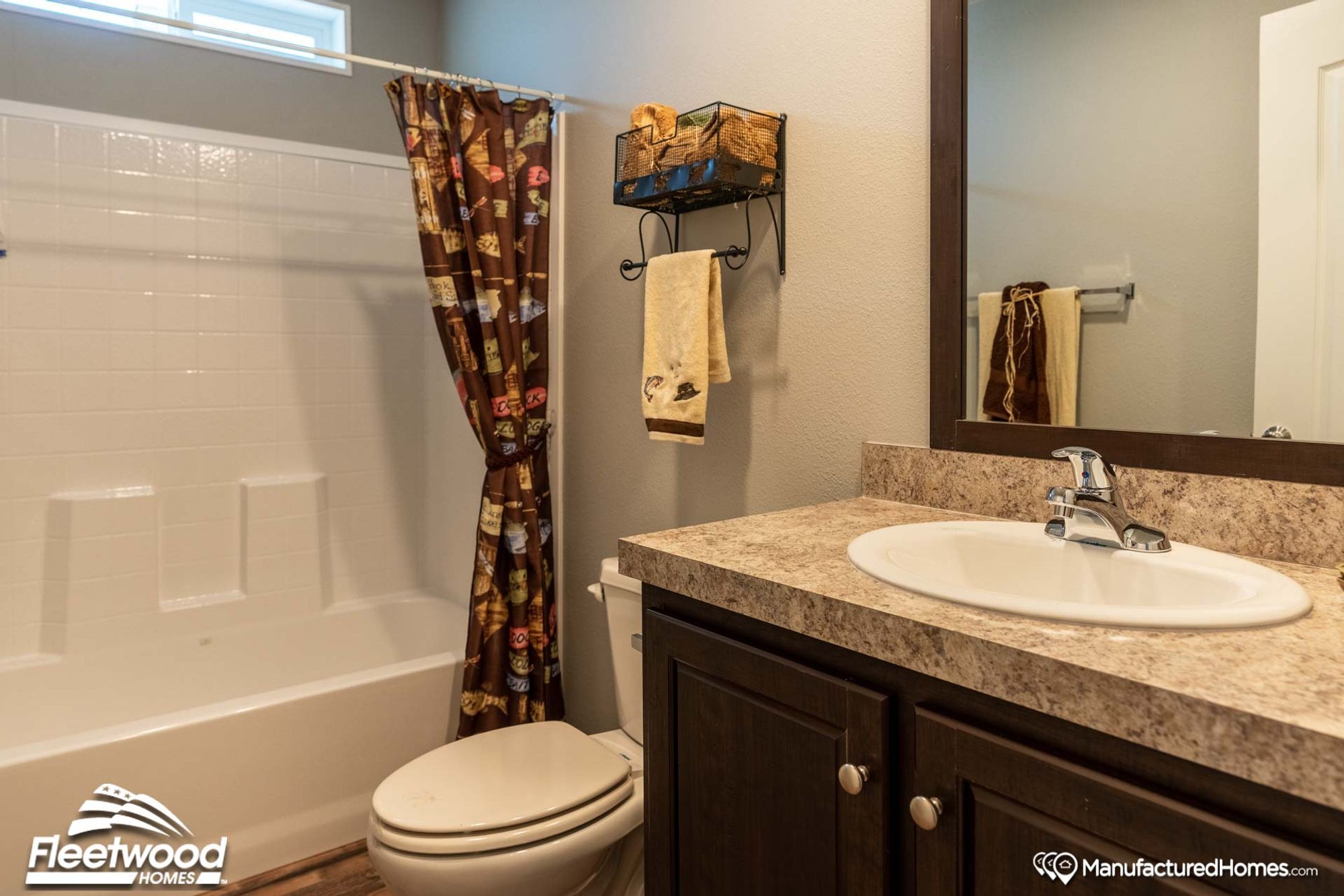 Small bathroom with a single sink and a bathtub-shower combo.