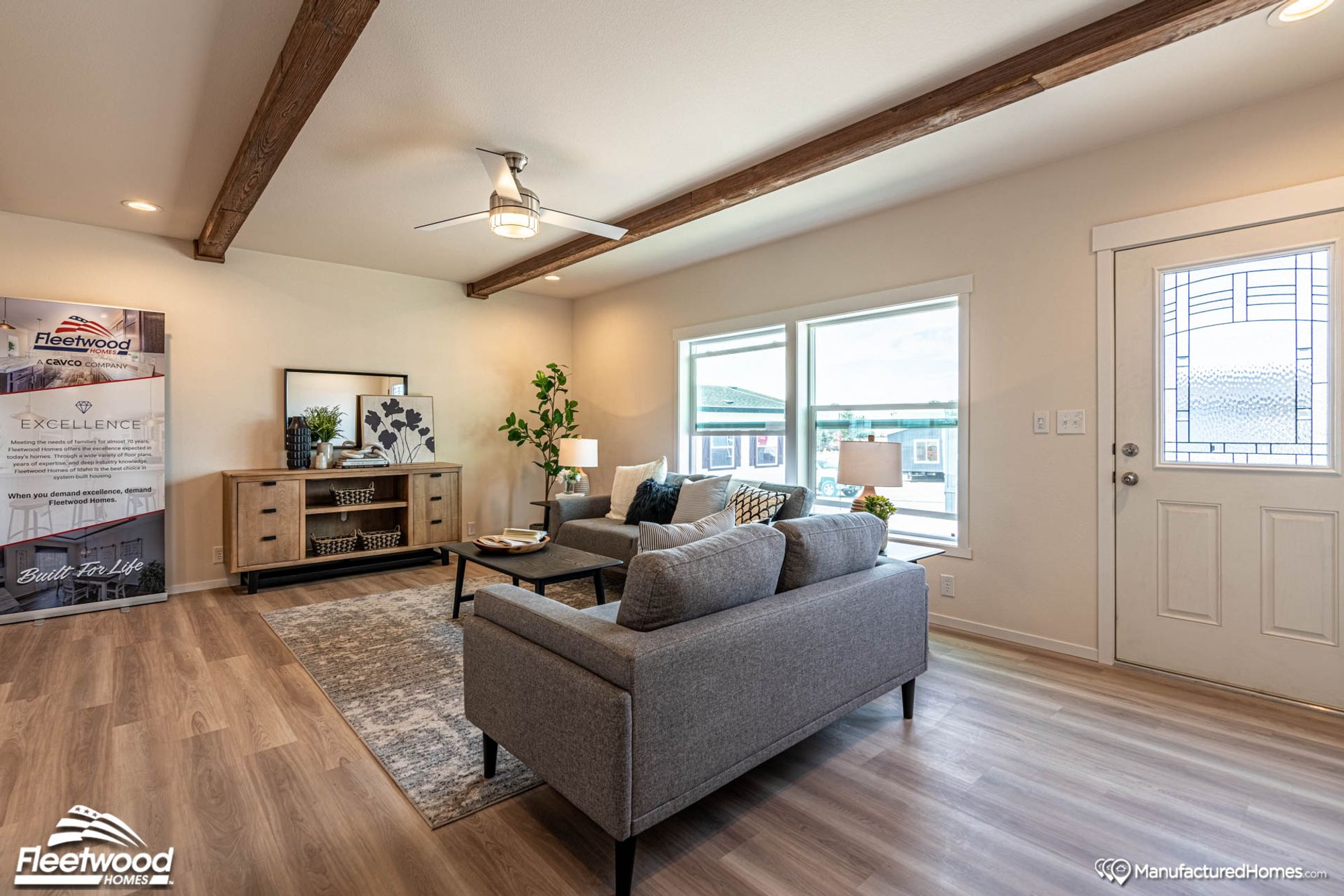 Large living room with two couches and a coffee table.
