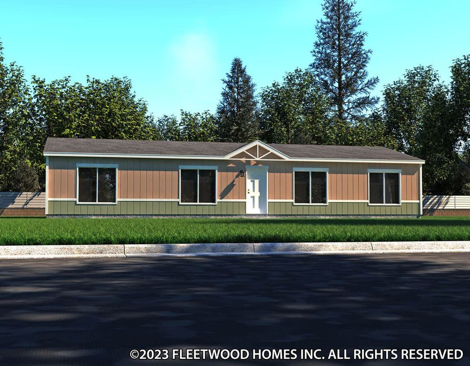 Single-story manufactured home with tan and green siding, white trim, and a centered front door under a small gable accent.
