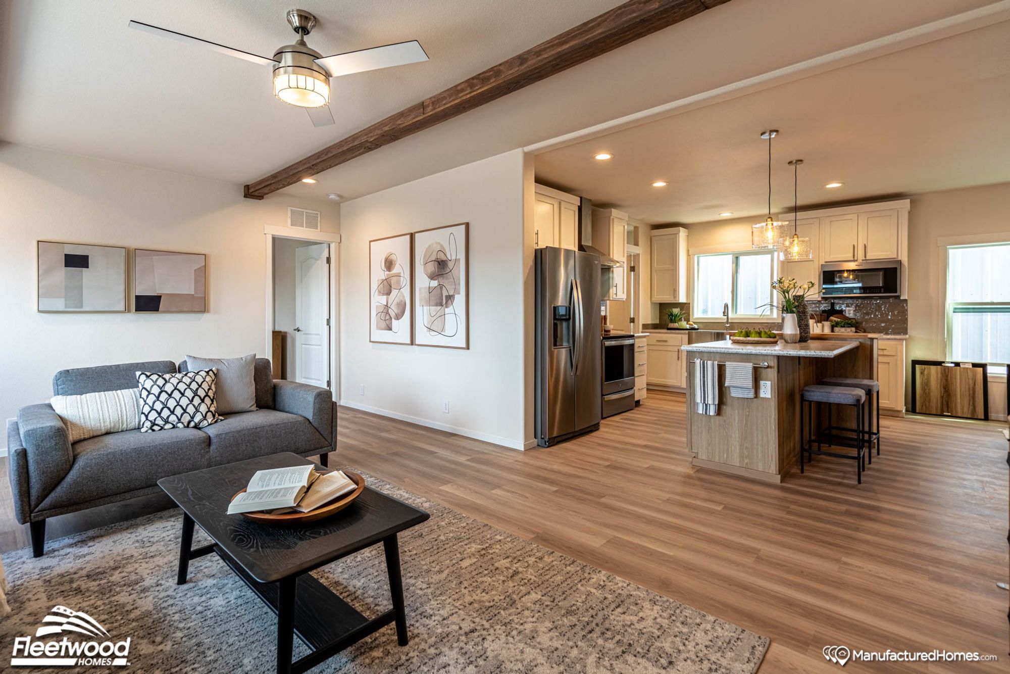 Open-layout living room and large kitchen with an island.