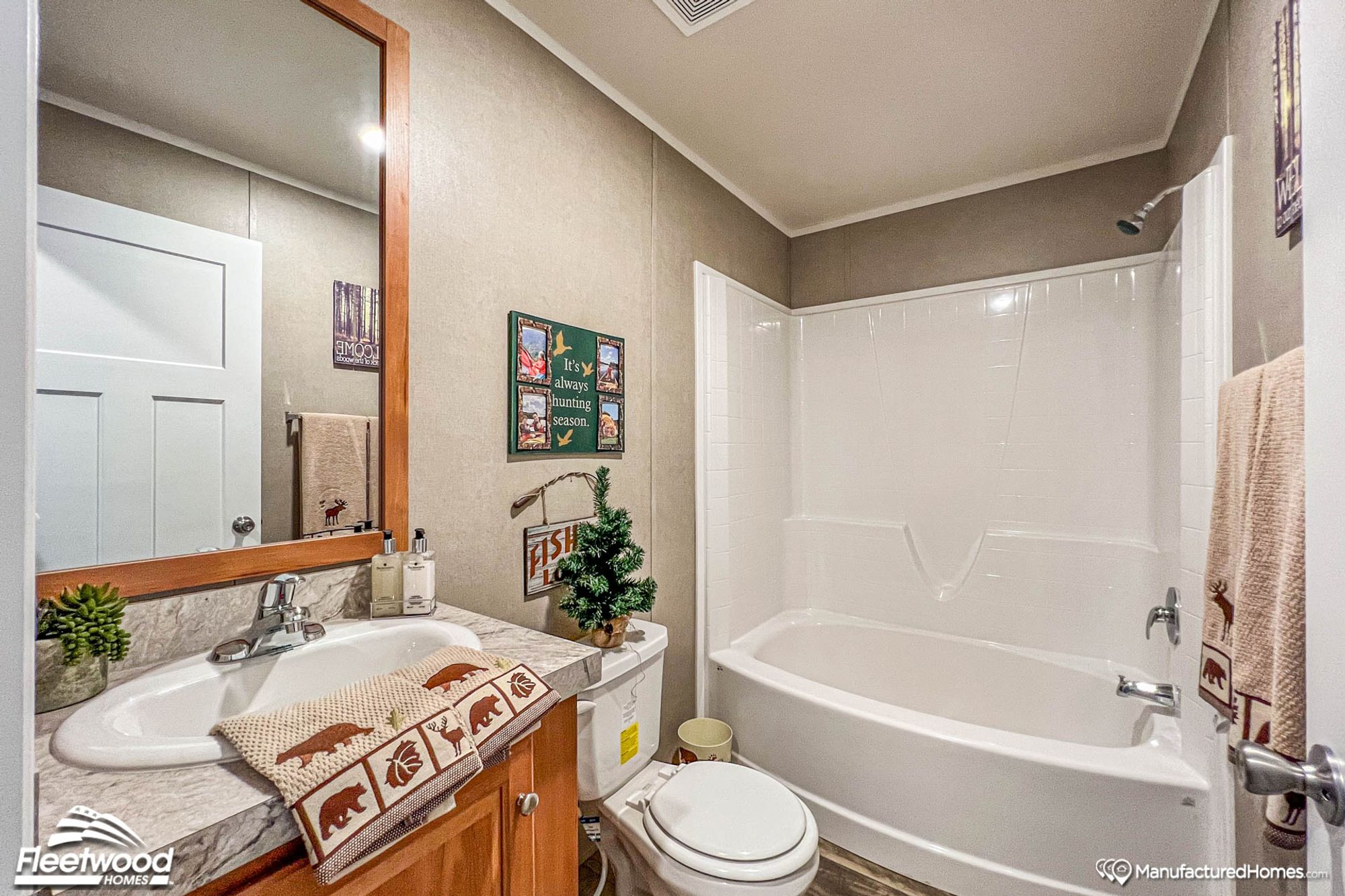 Small bathroom with a single sink and a bathtub-shower combo.