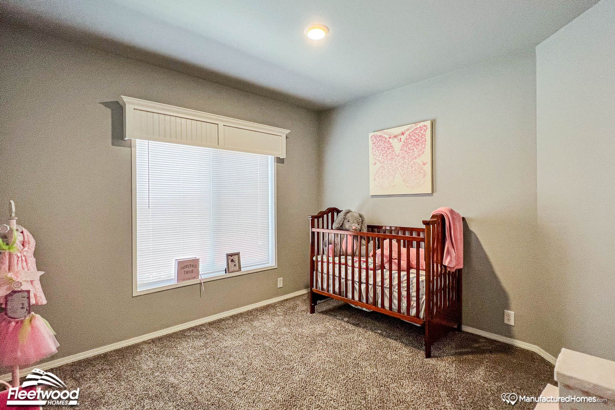 Empty mid-sized pink girl's nursery