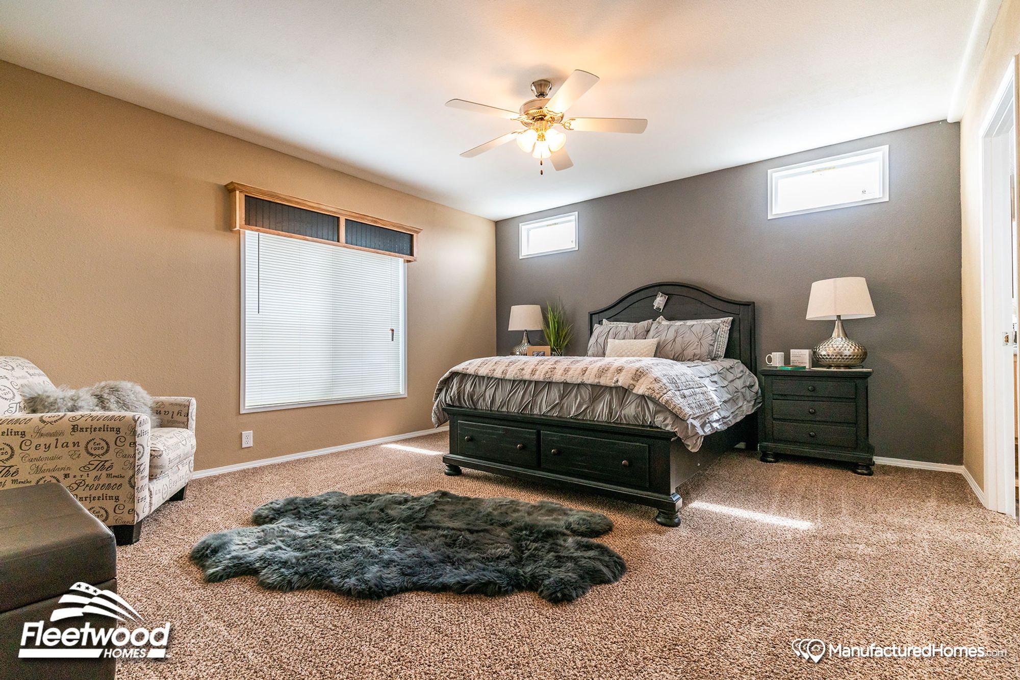 Mid-sized bedroom with two bedside tables and a single chair.