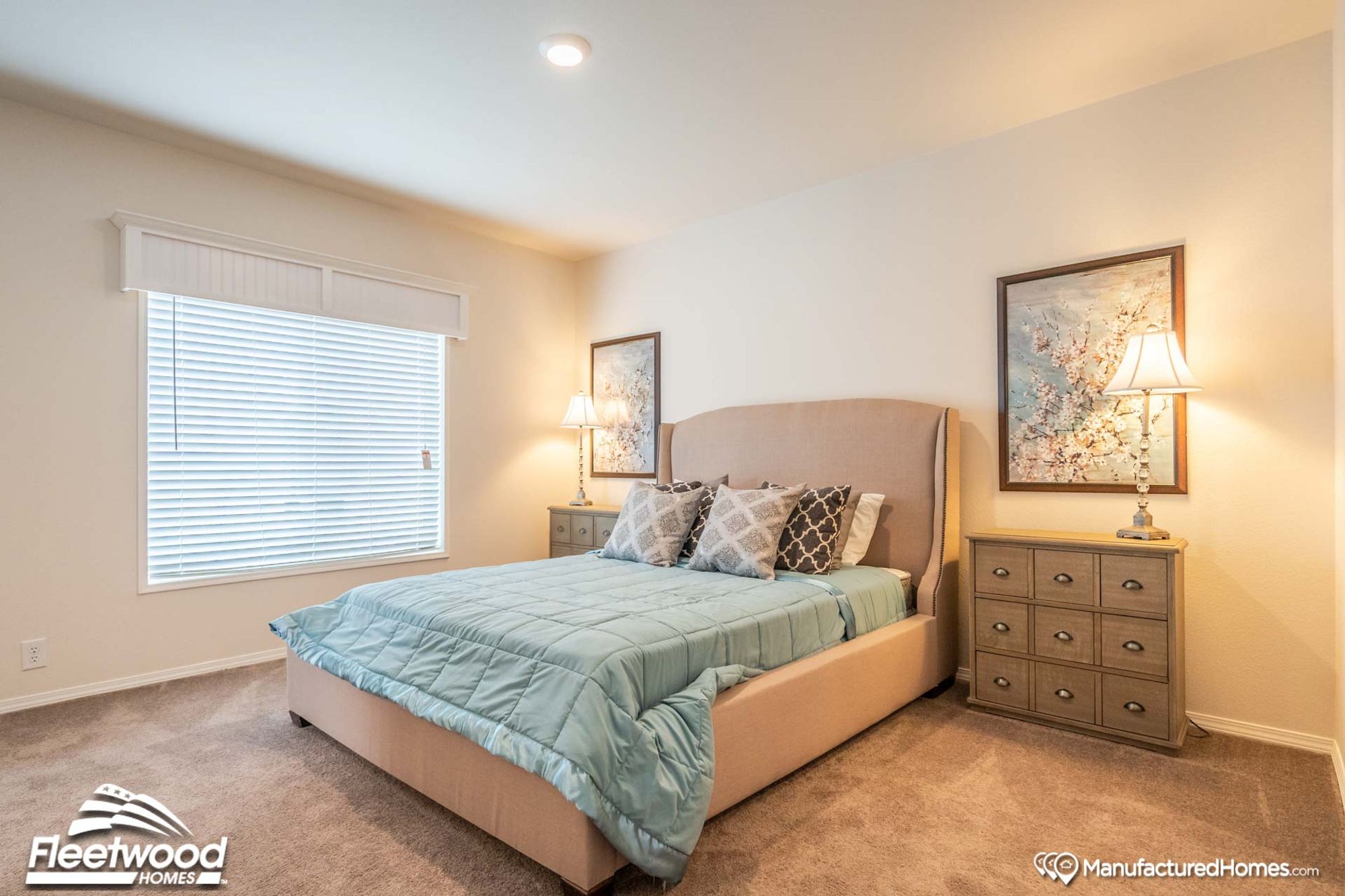 Medium-sized room with a full-sized bed and two bed-side tables.