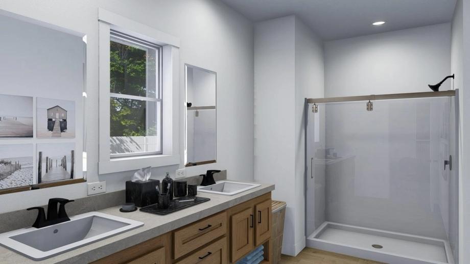Large bathroom with a double sink and a standing shower.