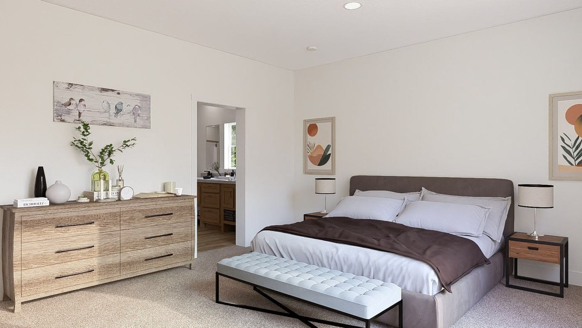 Large bedroom with a dresser, a large bed, and two end tables.