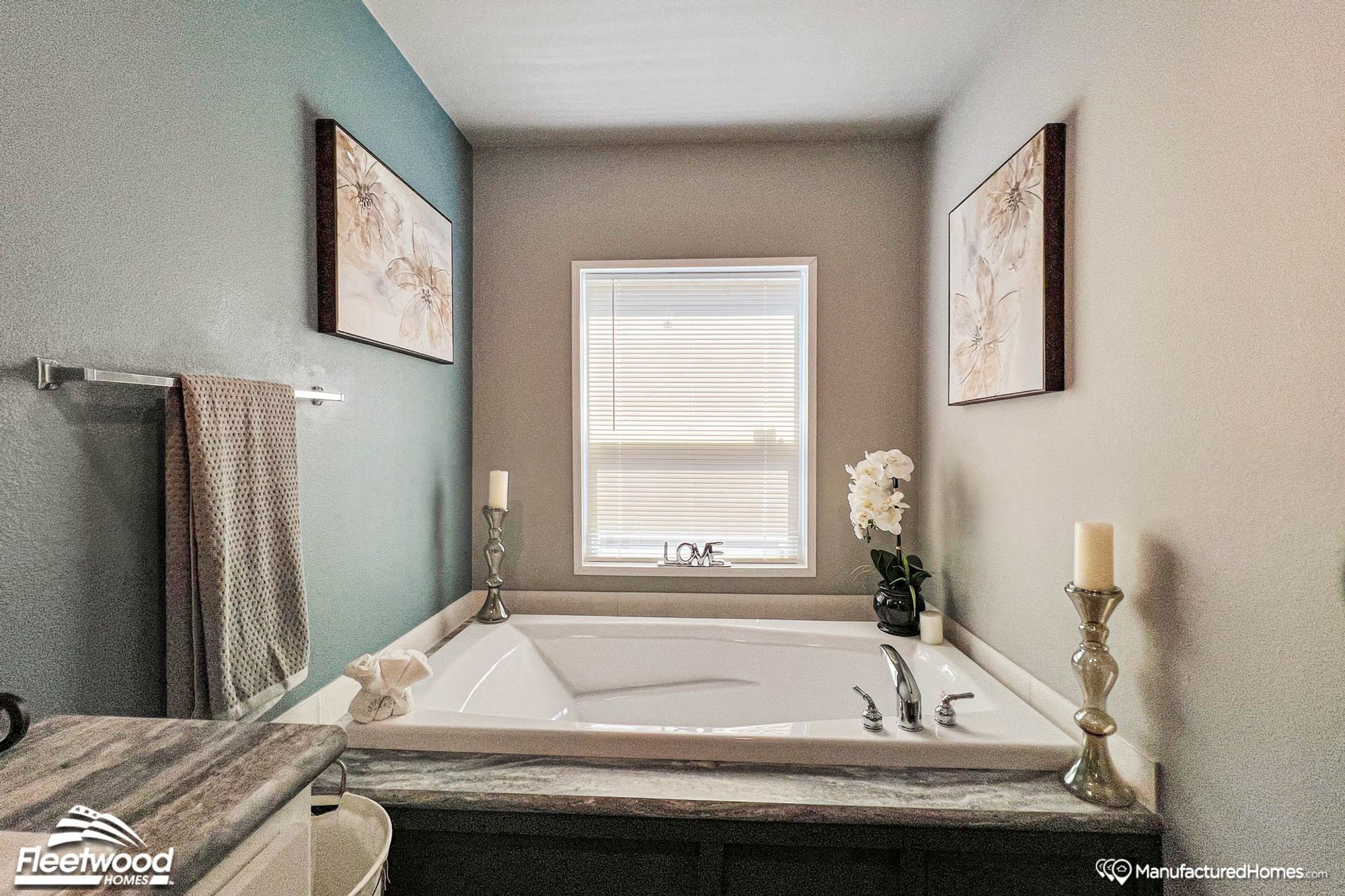 Close-up of a bathroom with a large bathtub.