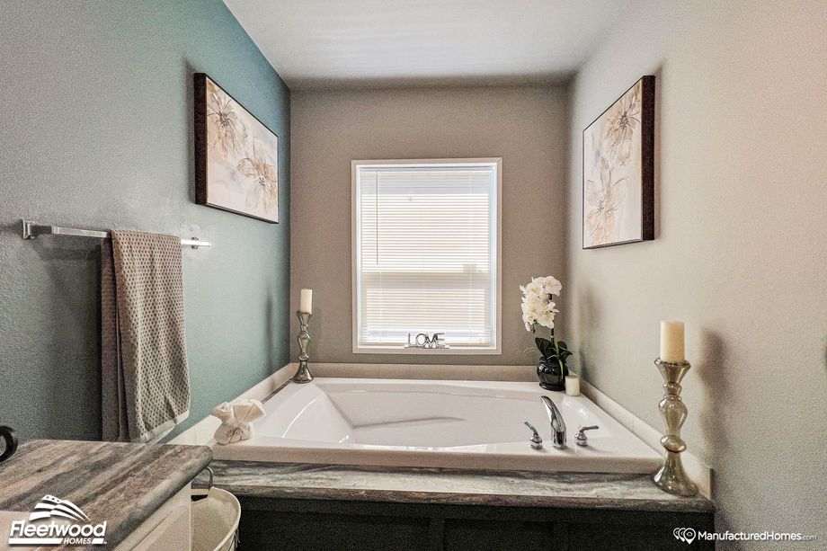 Close-up of a bathroom with a large bathtub.
