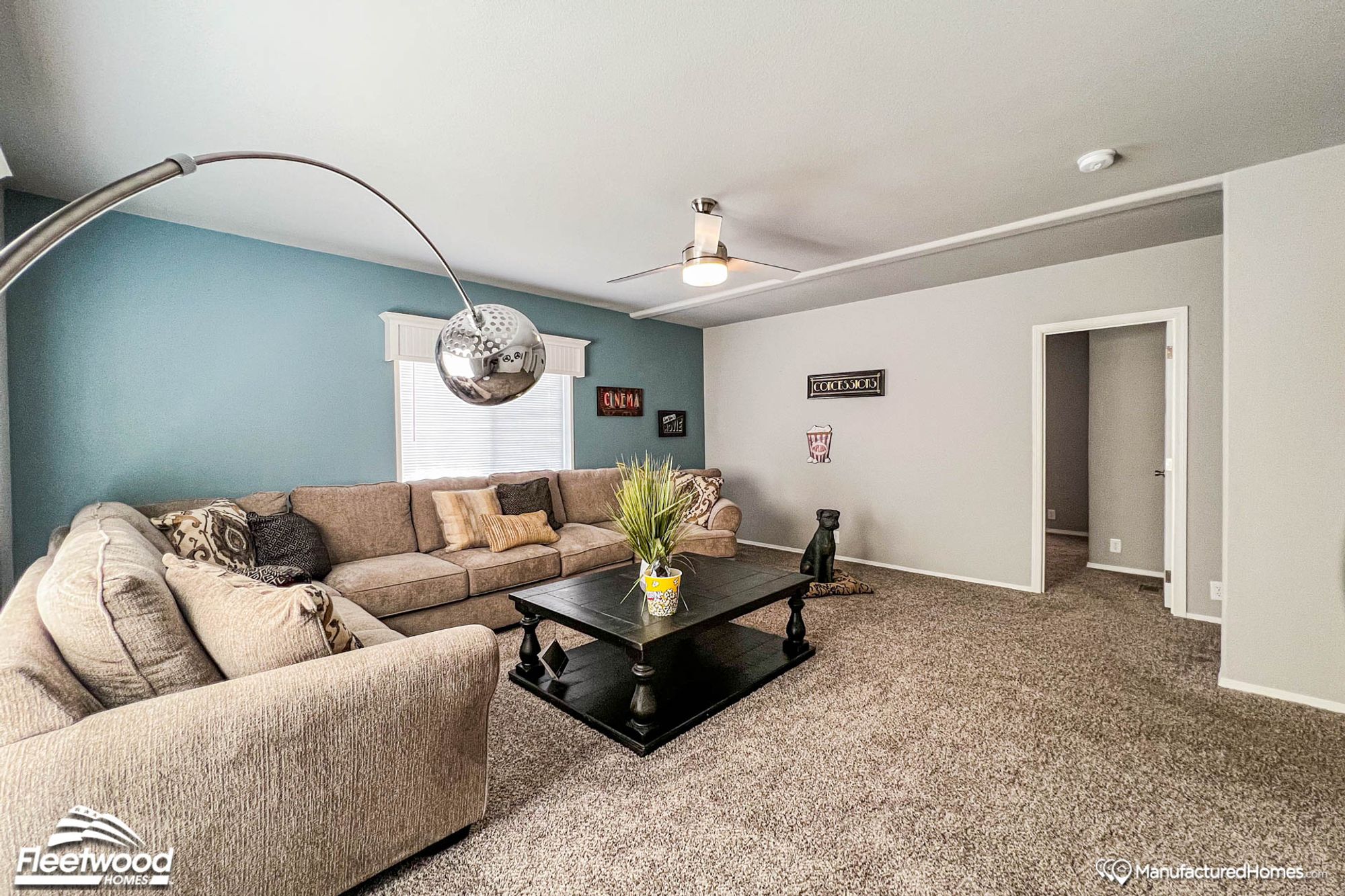 Large living room with an oversized couch and a coffee table.