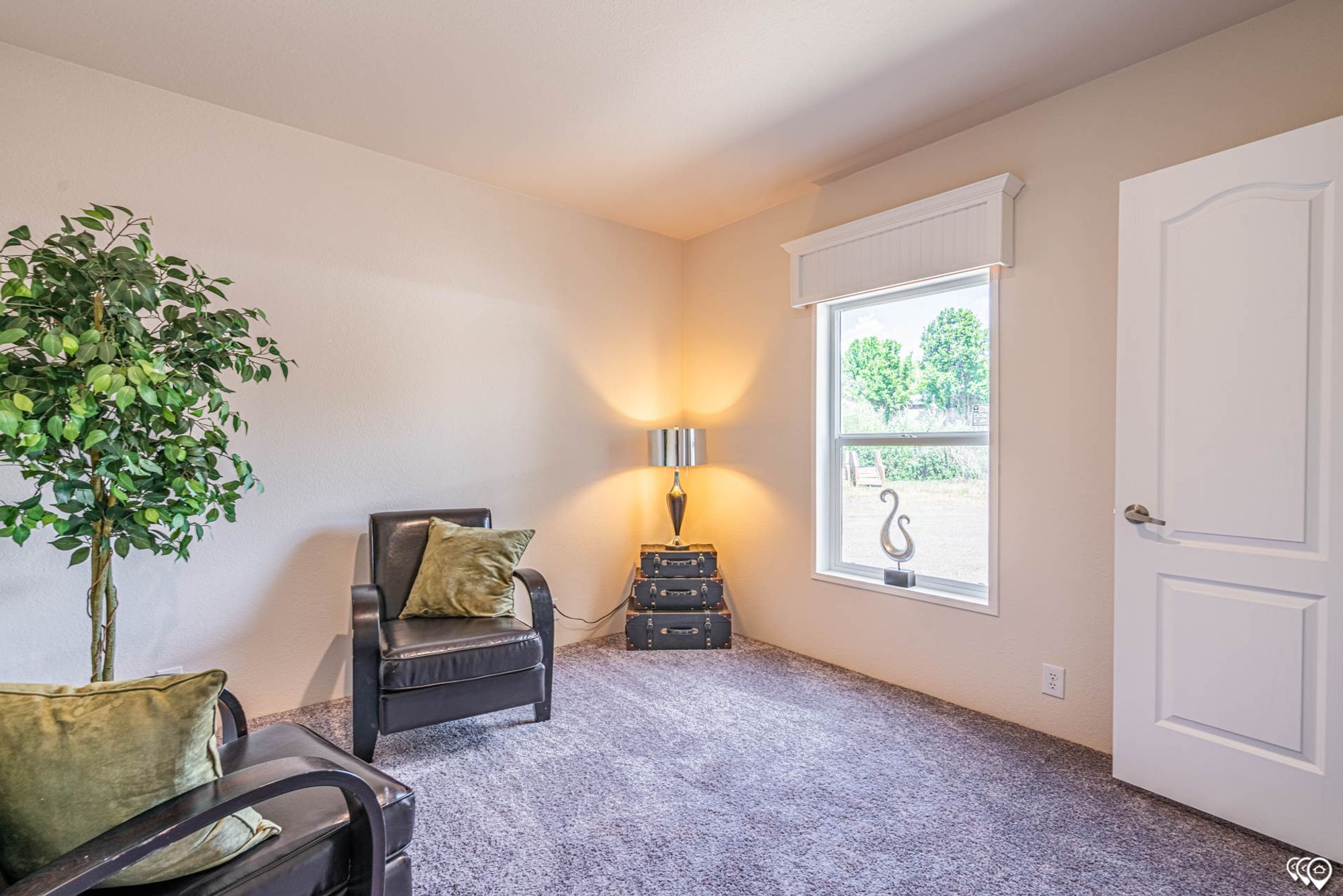 Mid-sized room with two chairs.