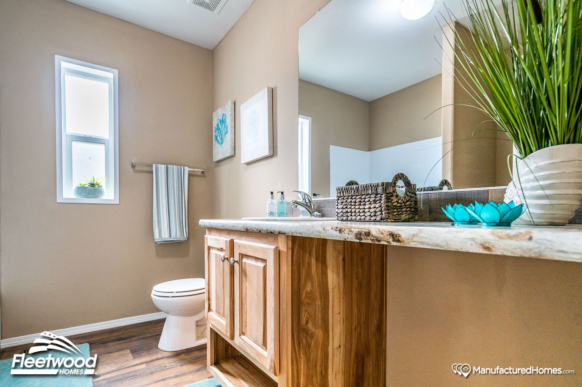 Mid-sized bathroom with a single sink counter top.