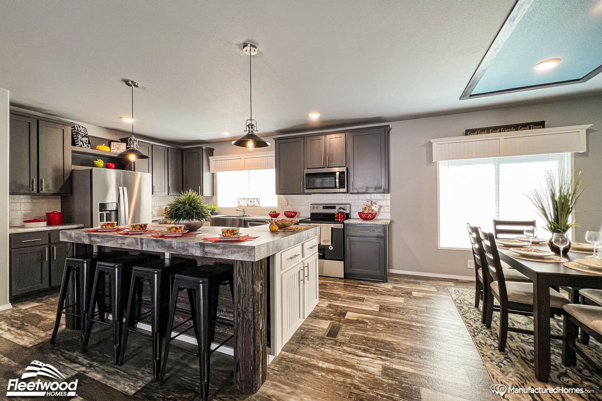 Open-concept kitchen and dining room with an island in the kitchen.