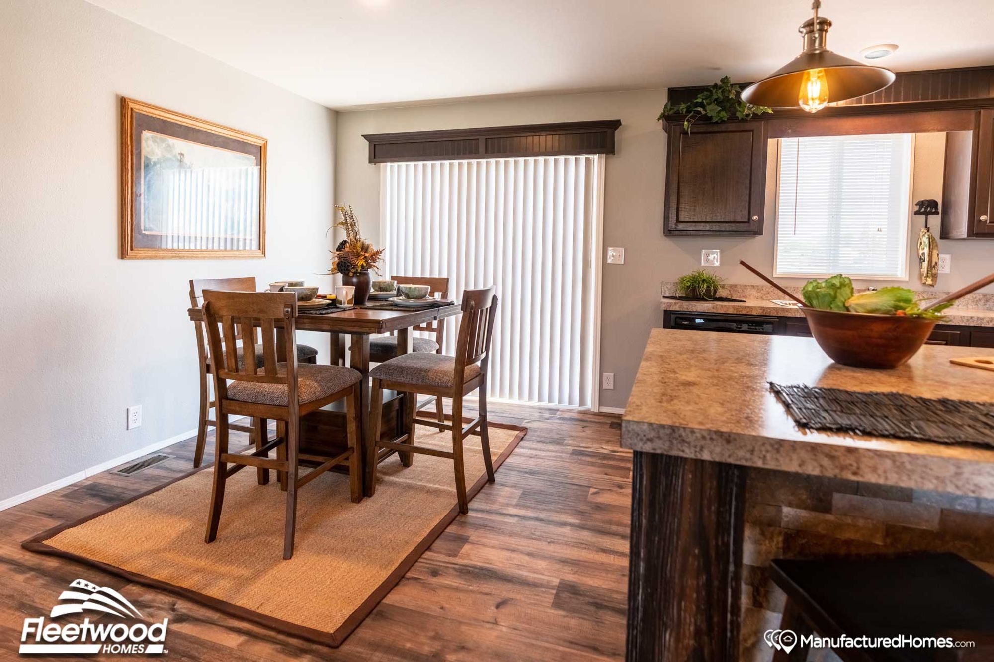 Large dining room with open access to the kitchen and a table that seats 4.