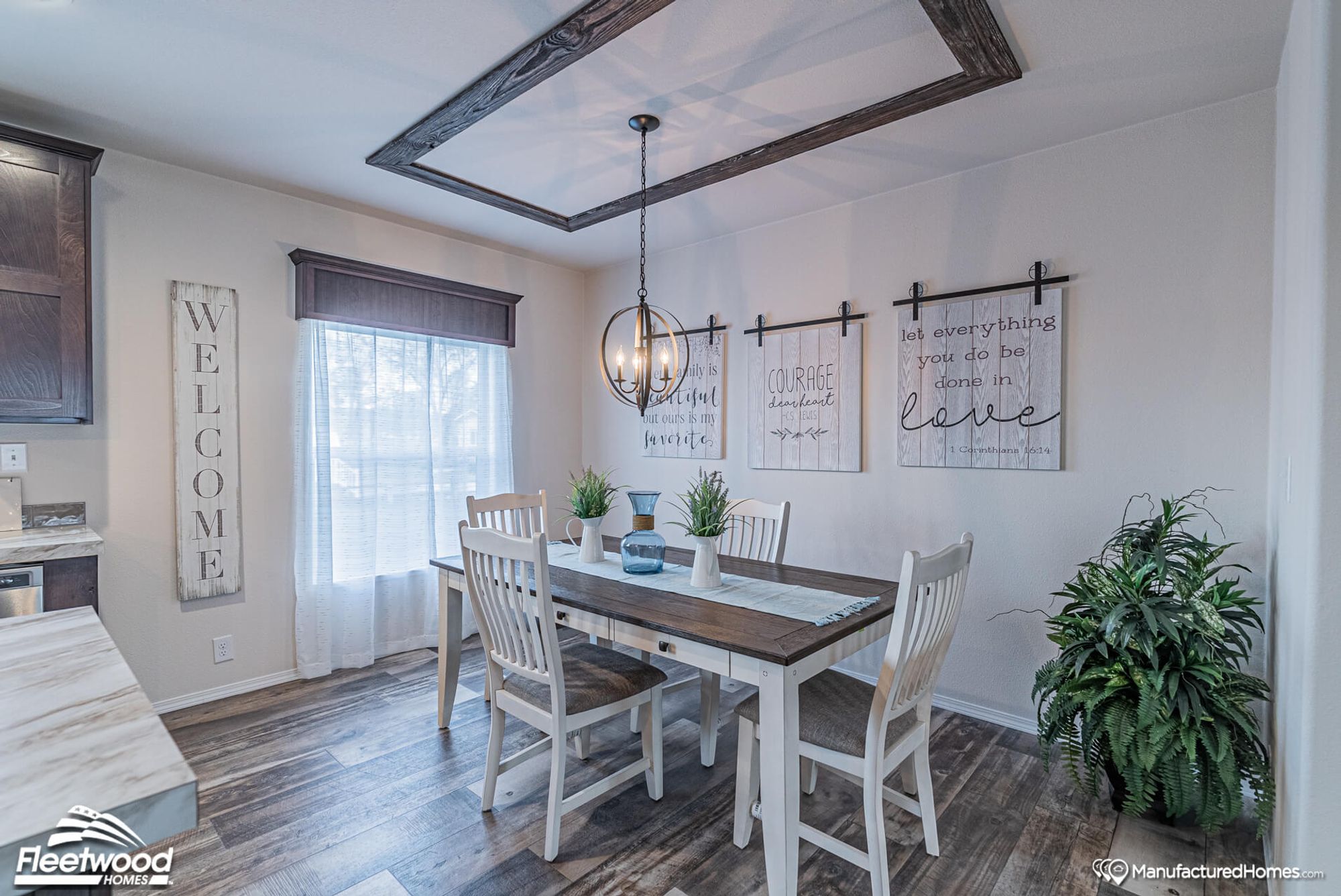 Dining room with a table that seats 4.