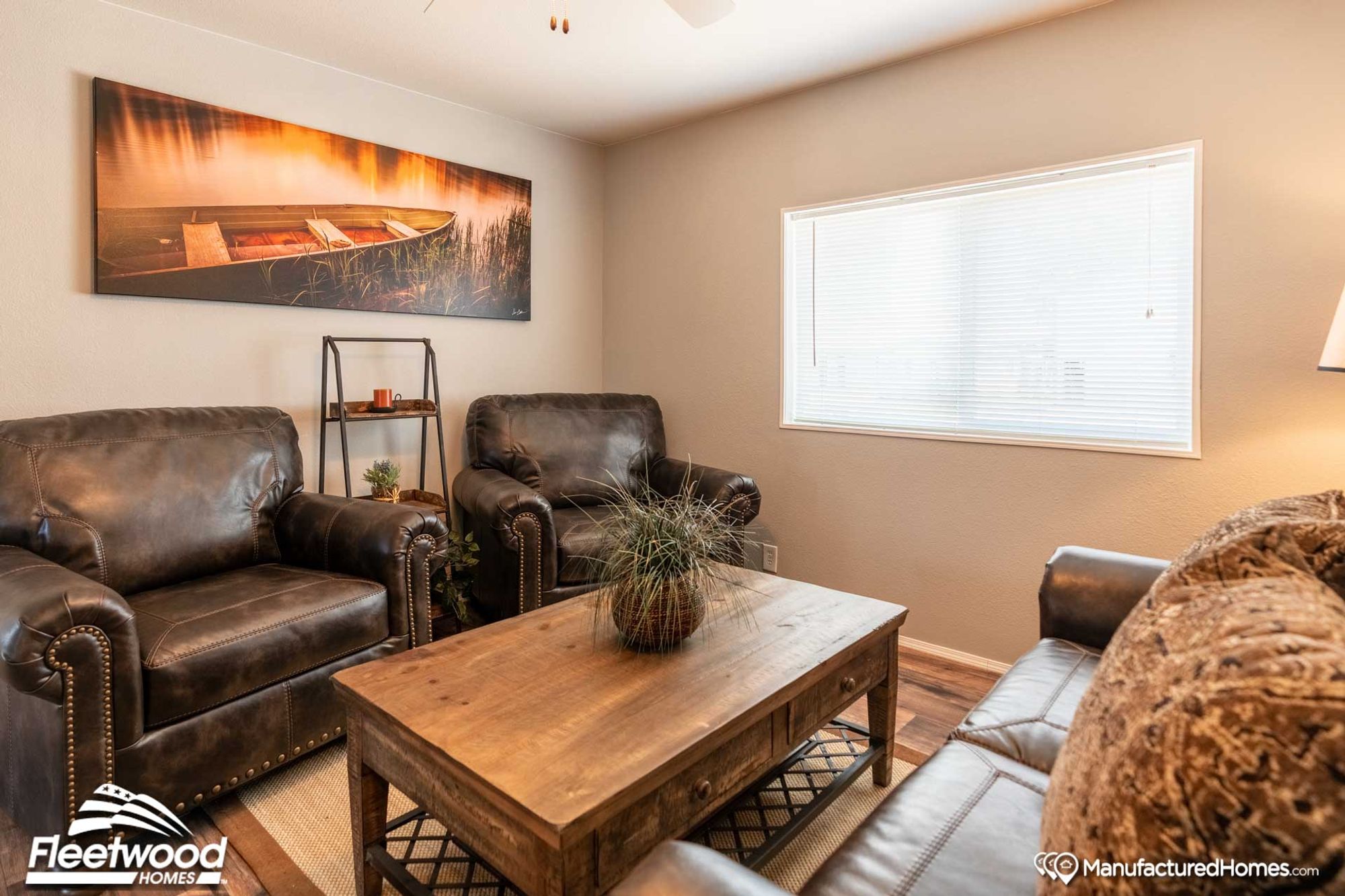 Mid-sized living room with a couch, a coffee table, a side table, and two chairs.