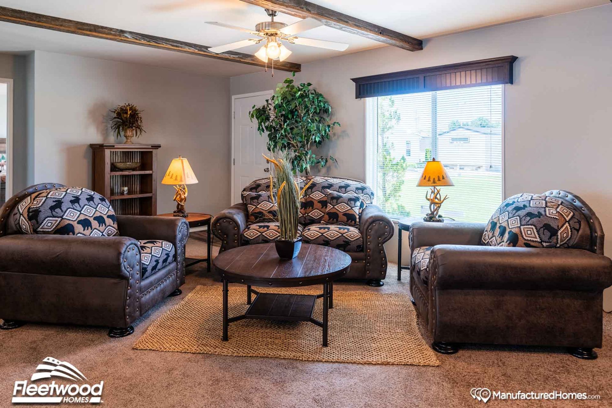 Mid-sized living room with a couch, a coffee table, two side tables, and two chairs.