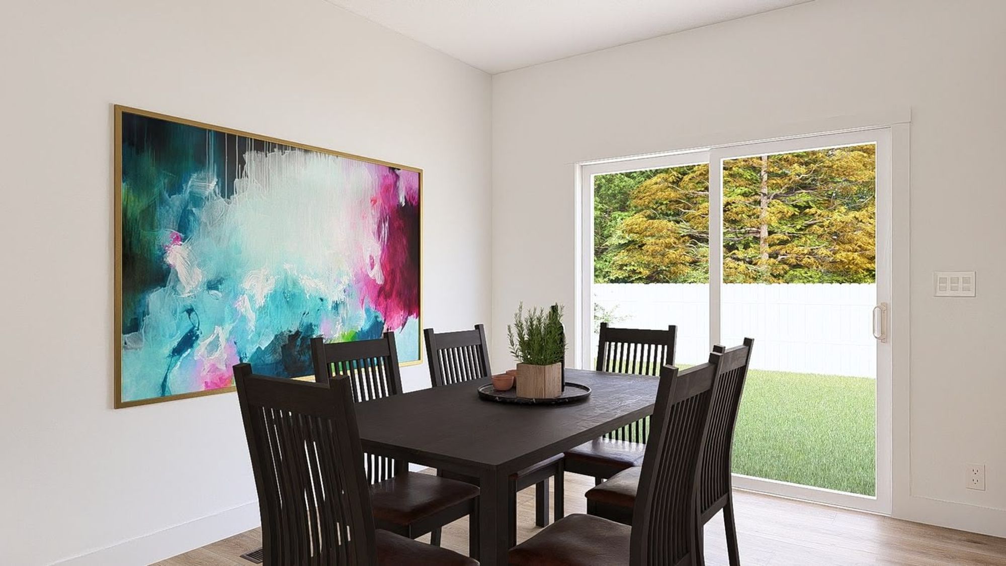 Dining room with a sliding glass door and a table that seats 6 people.