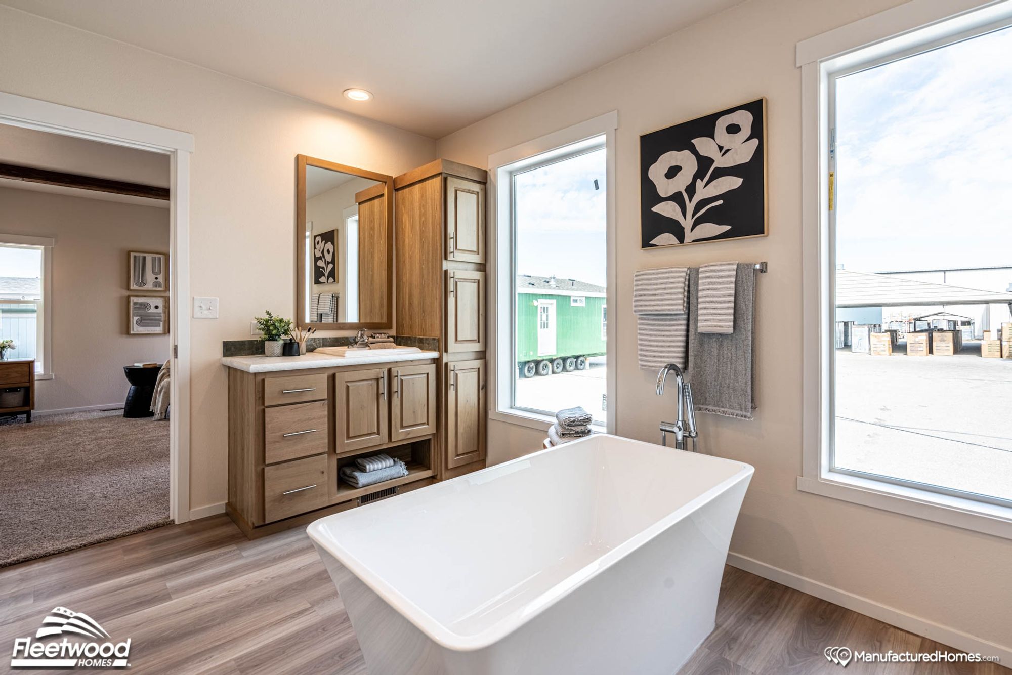 Large bathroom with a bathtub.
