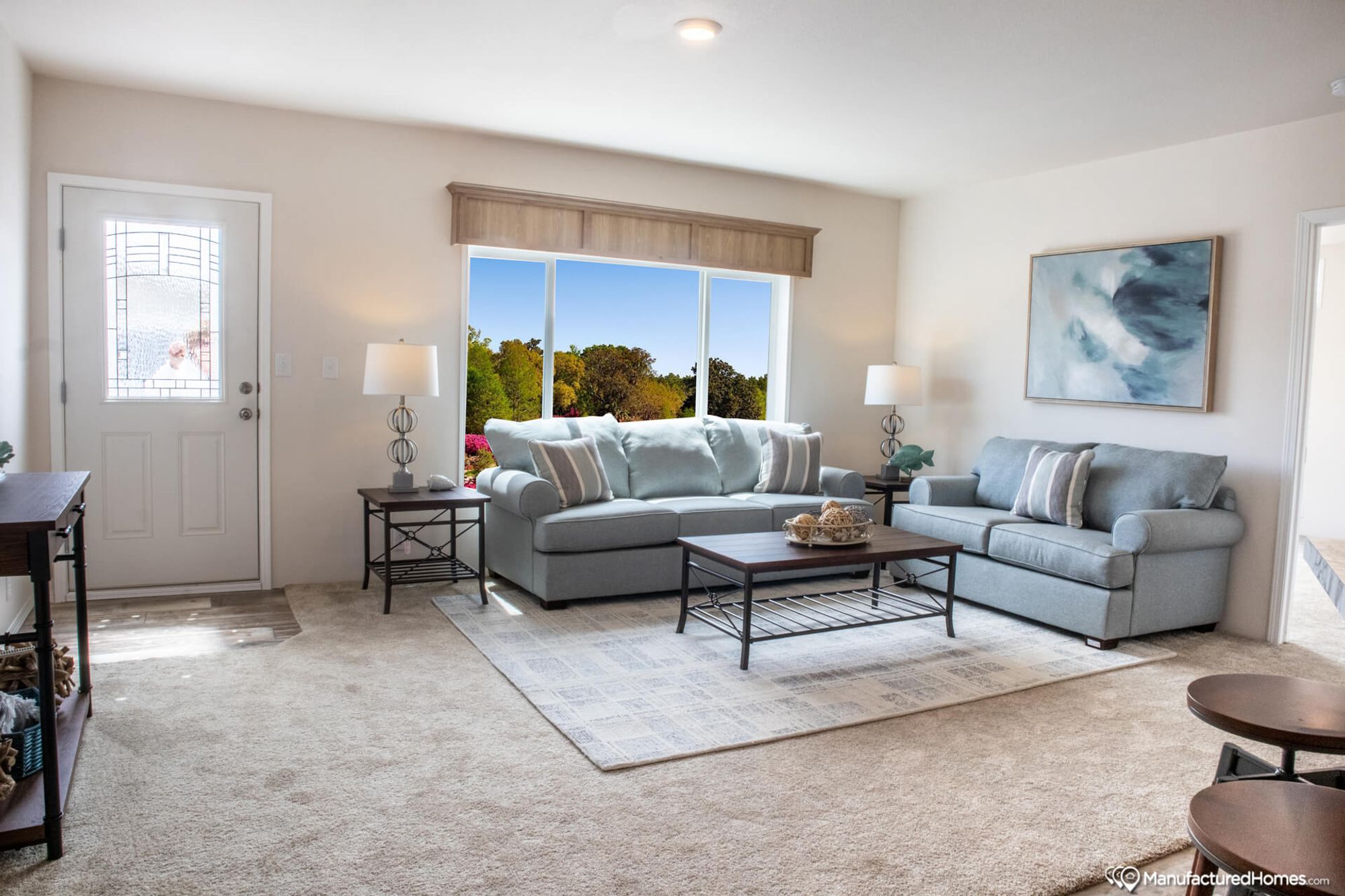 Large living room with two couches, two side tables, and a coffee table.