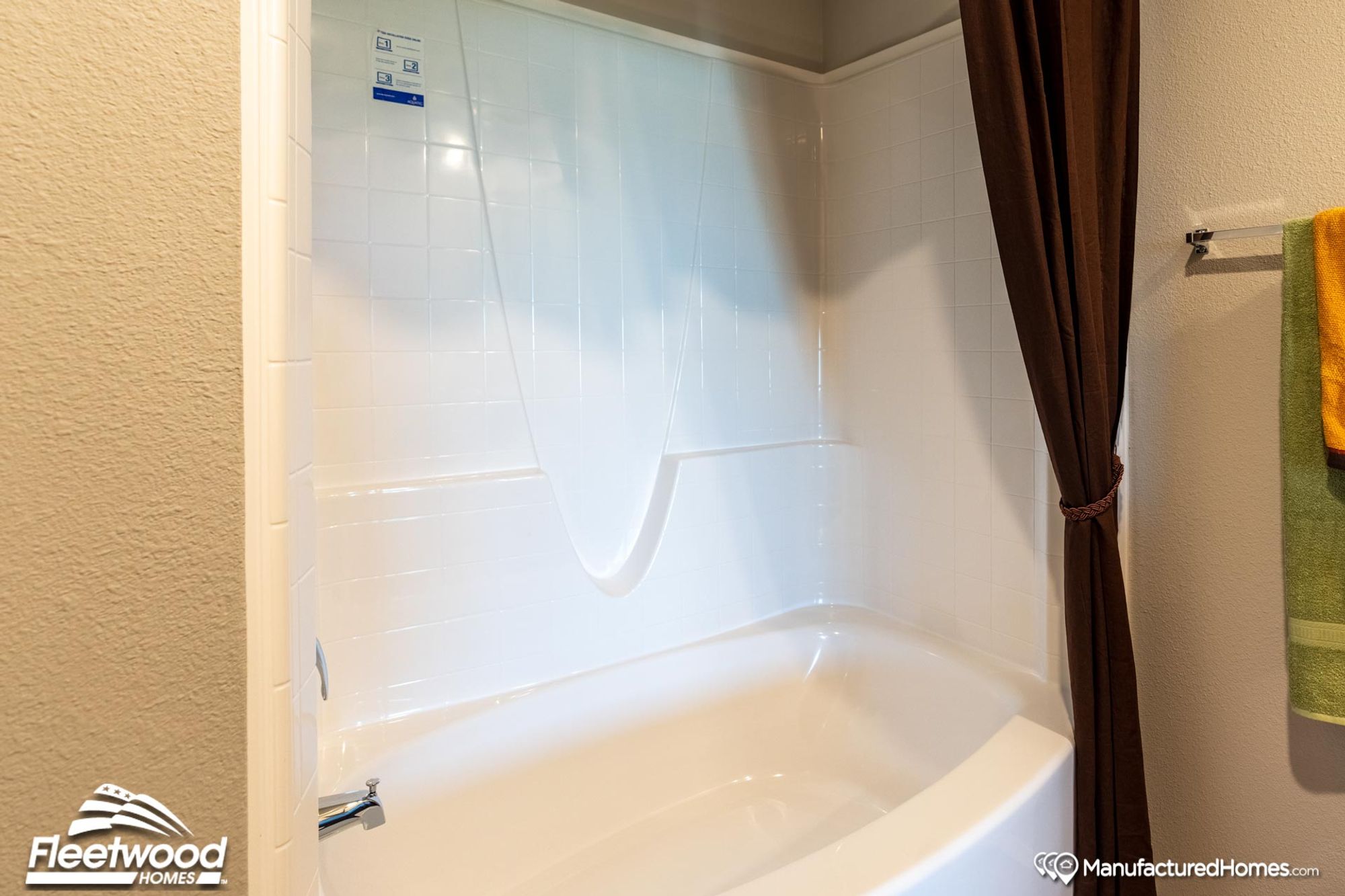 Close-up of a bathroom with a bathtub-shower combo.