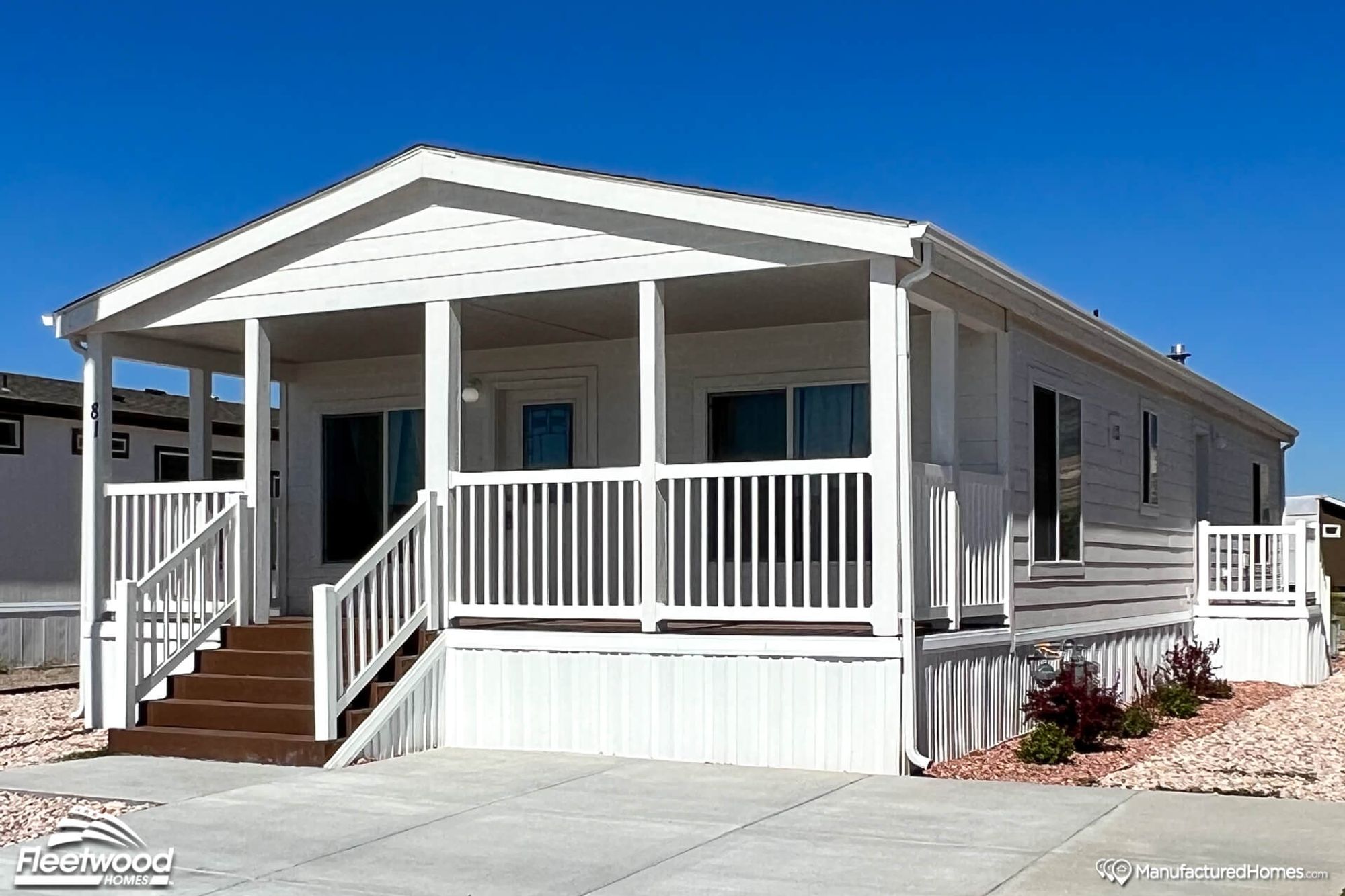 One-story white house with a covered front porch.