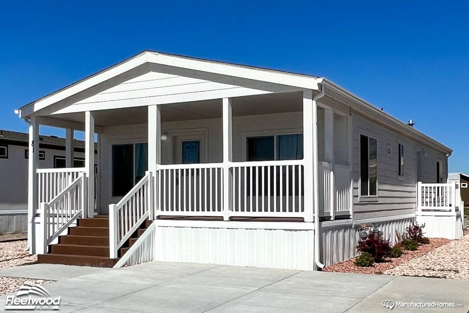 One-story white house with a covered front porch.