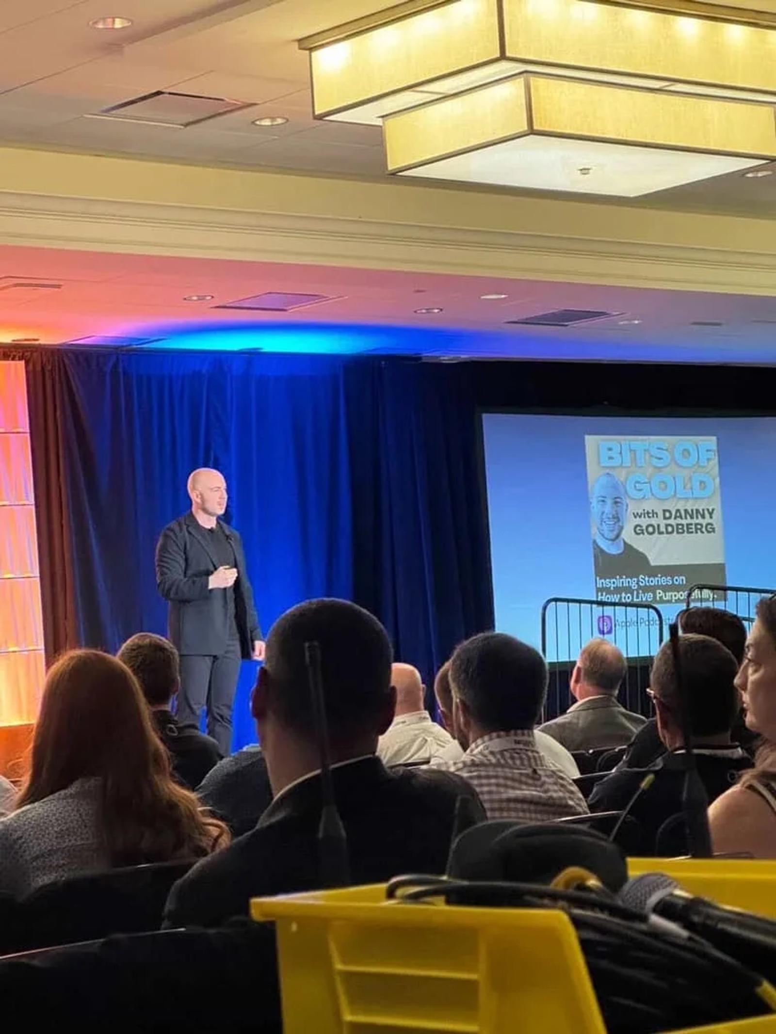 Danny Goldberg presenting his Bits of Gold keynote to a seated conference audience