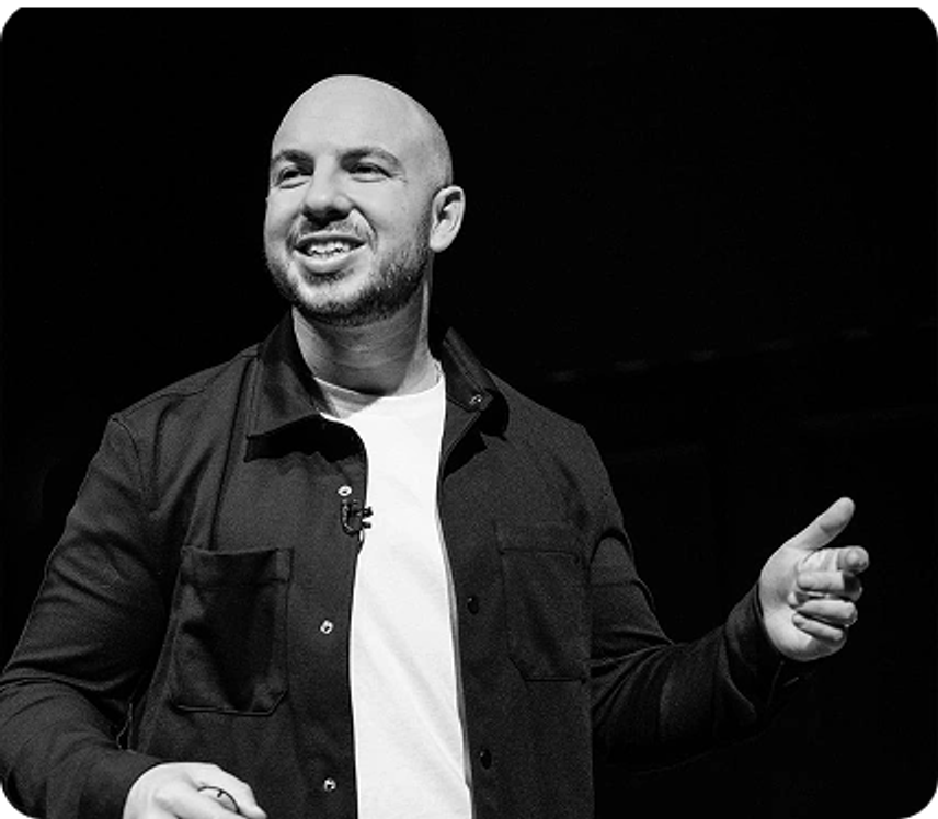 Danny Goldberg speaking on stage, black and white photo
