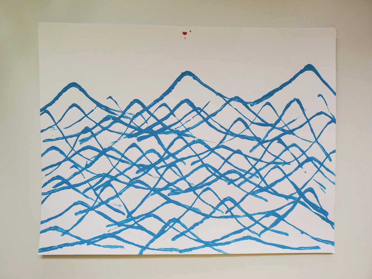 Blue triangular lines layered over each other on a white page