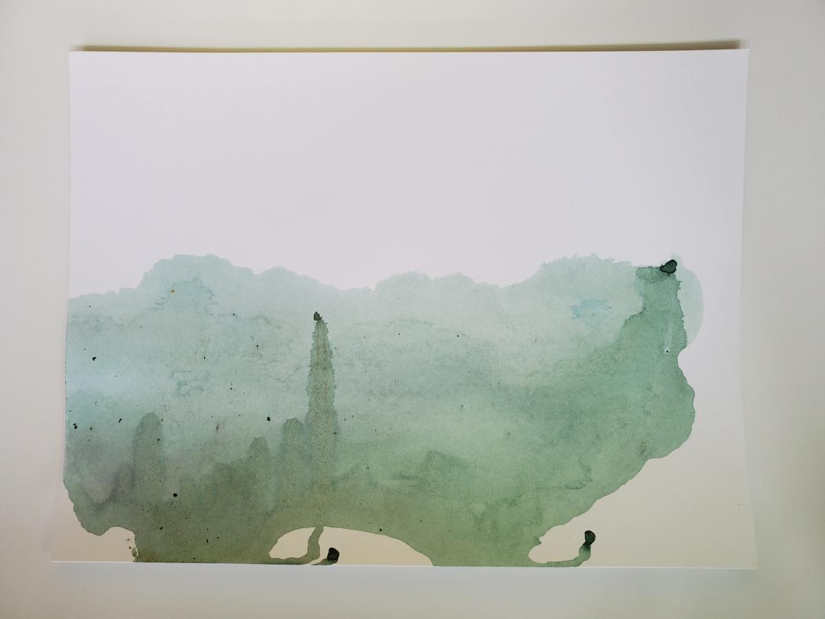 Green ink on a white page appearing to drip upwards