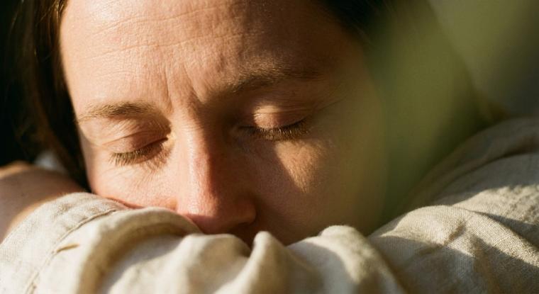 Quiet face in warm gold light