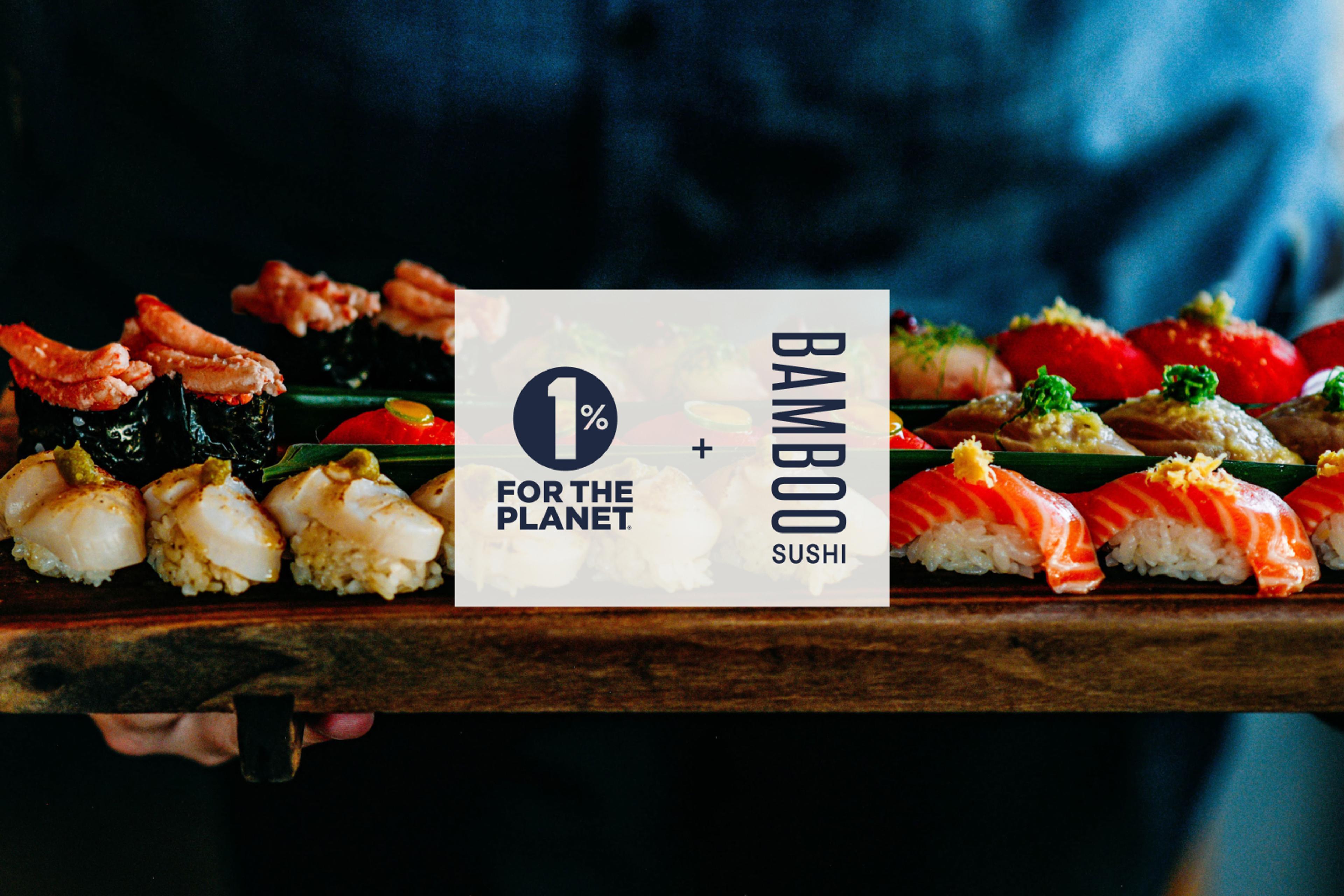 An array of sushi on a wood board with a "1% For The Plant + Bamboo Sushi" graphic superimposed on top.