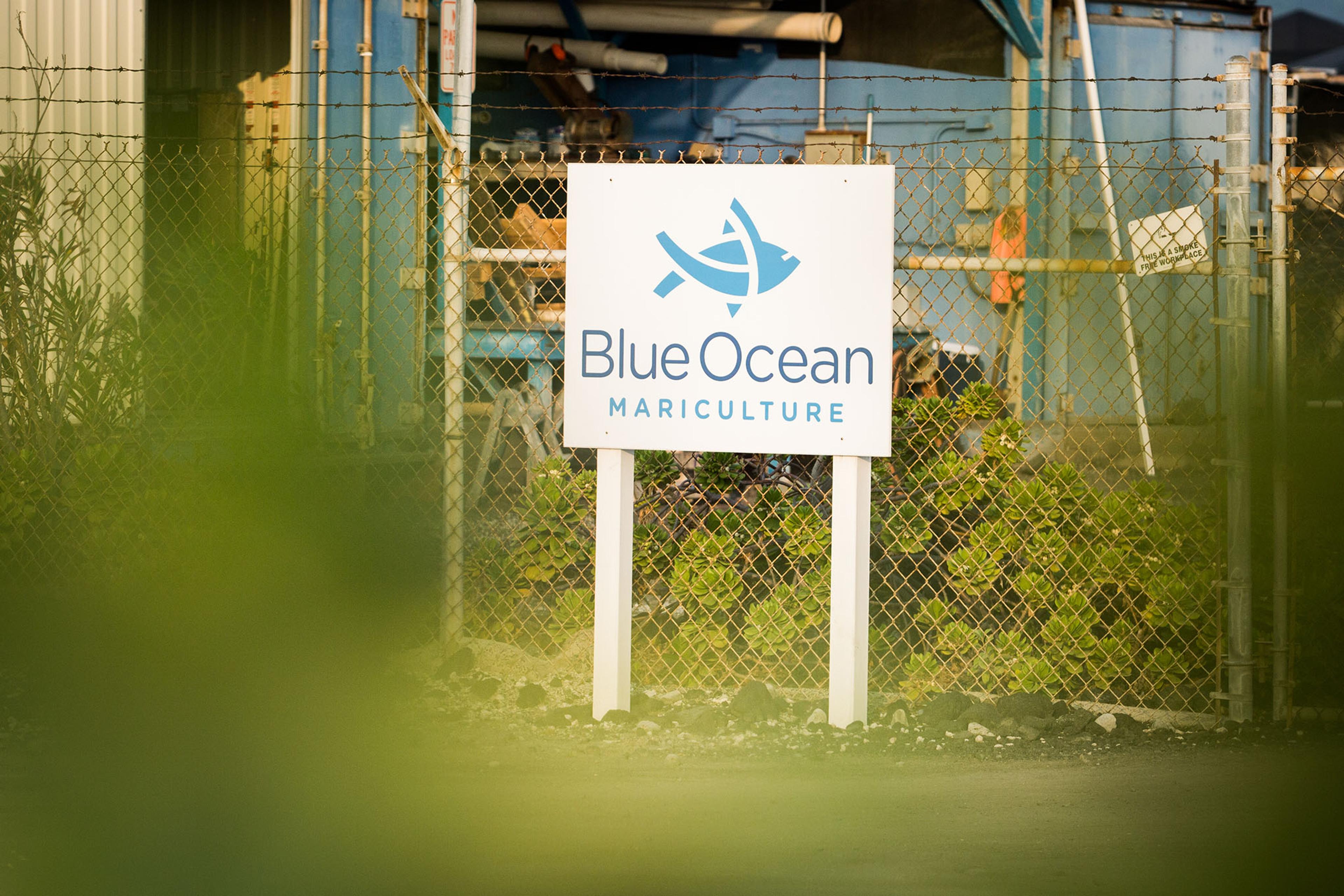 A Blue Ocean Mariculture sign outside the fishery building.