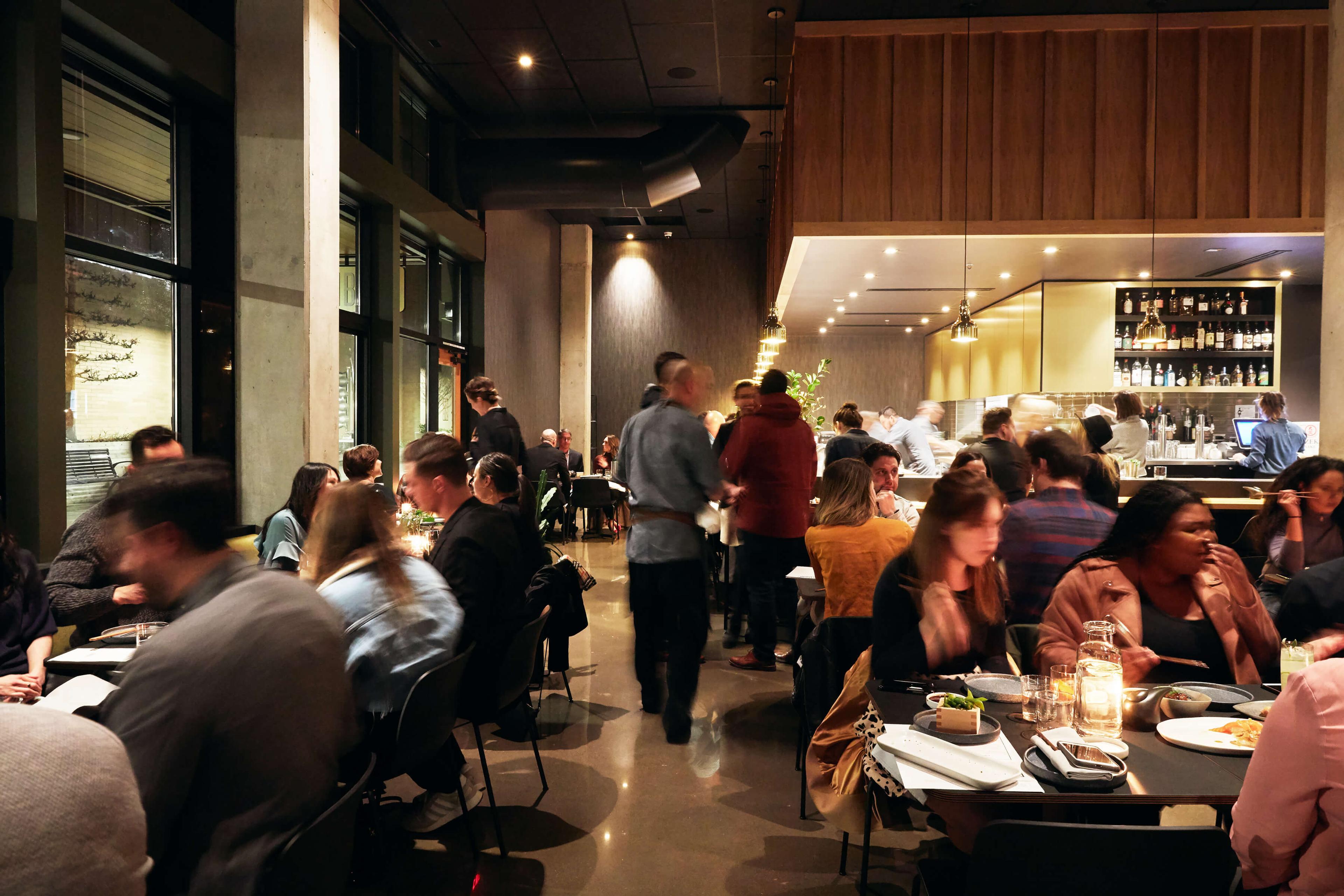 People enjoying dinner service at the Lake Oswego Bamboo Sushi restaurant.