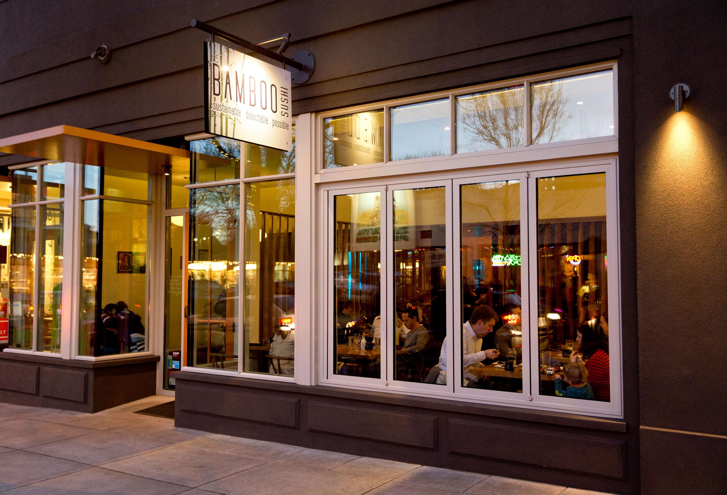 Exterior of NW Portland Bamboo Sushi restaurant at night.