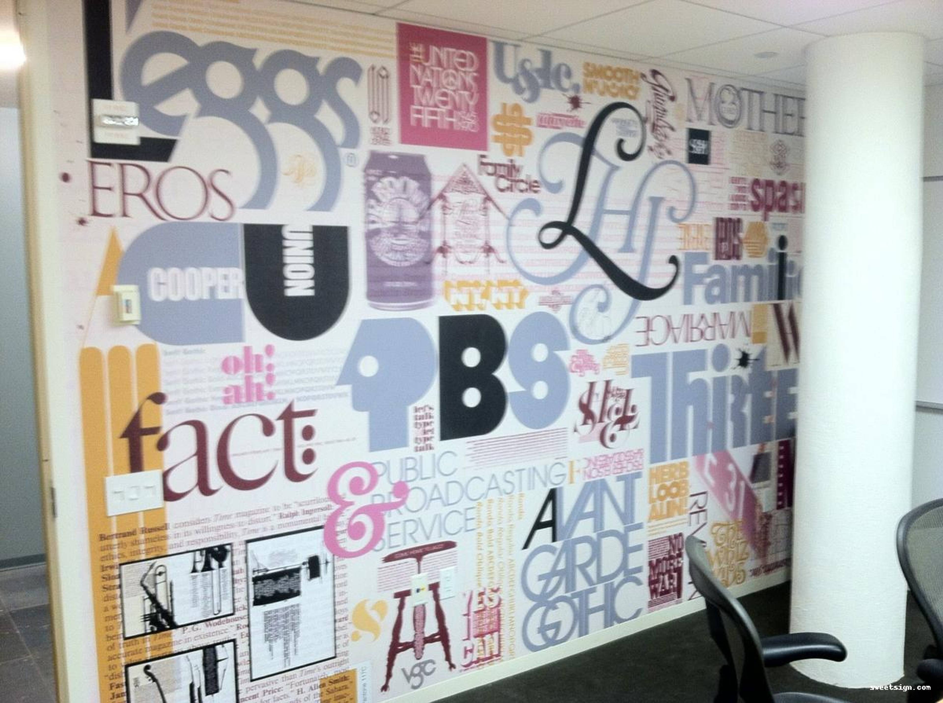 Creative typography office wall mural with PBS and Avant Garde Gothic style